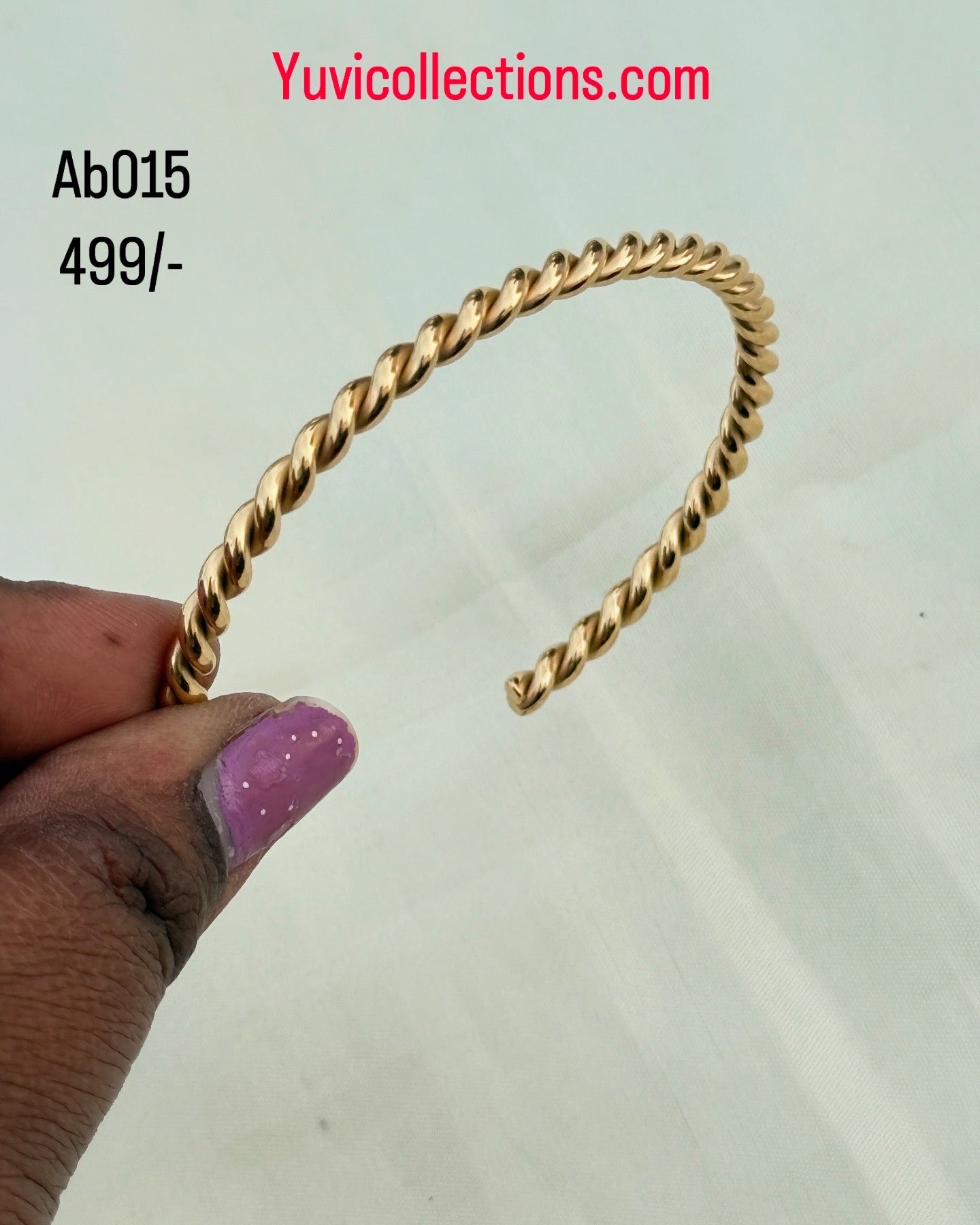 Ab015 gold spiral Anti tarnish bracelet