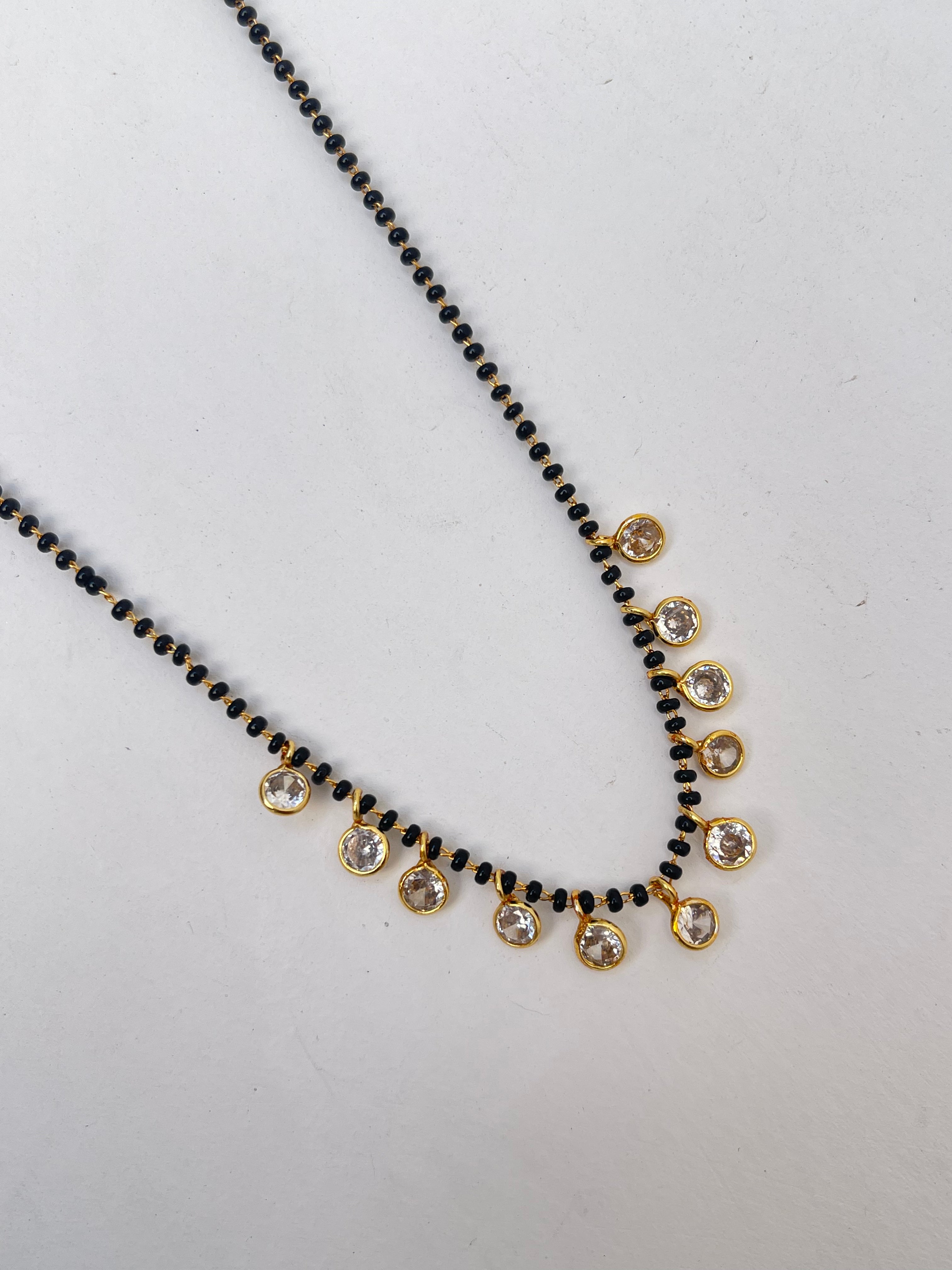 Black beads with 10 white stones