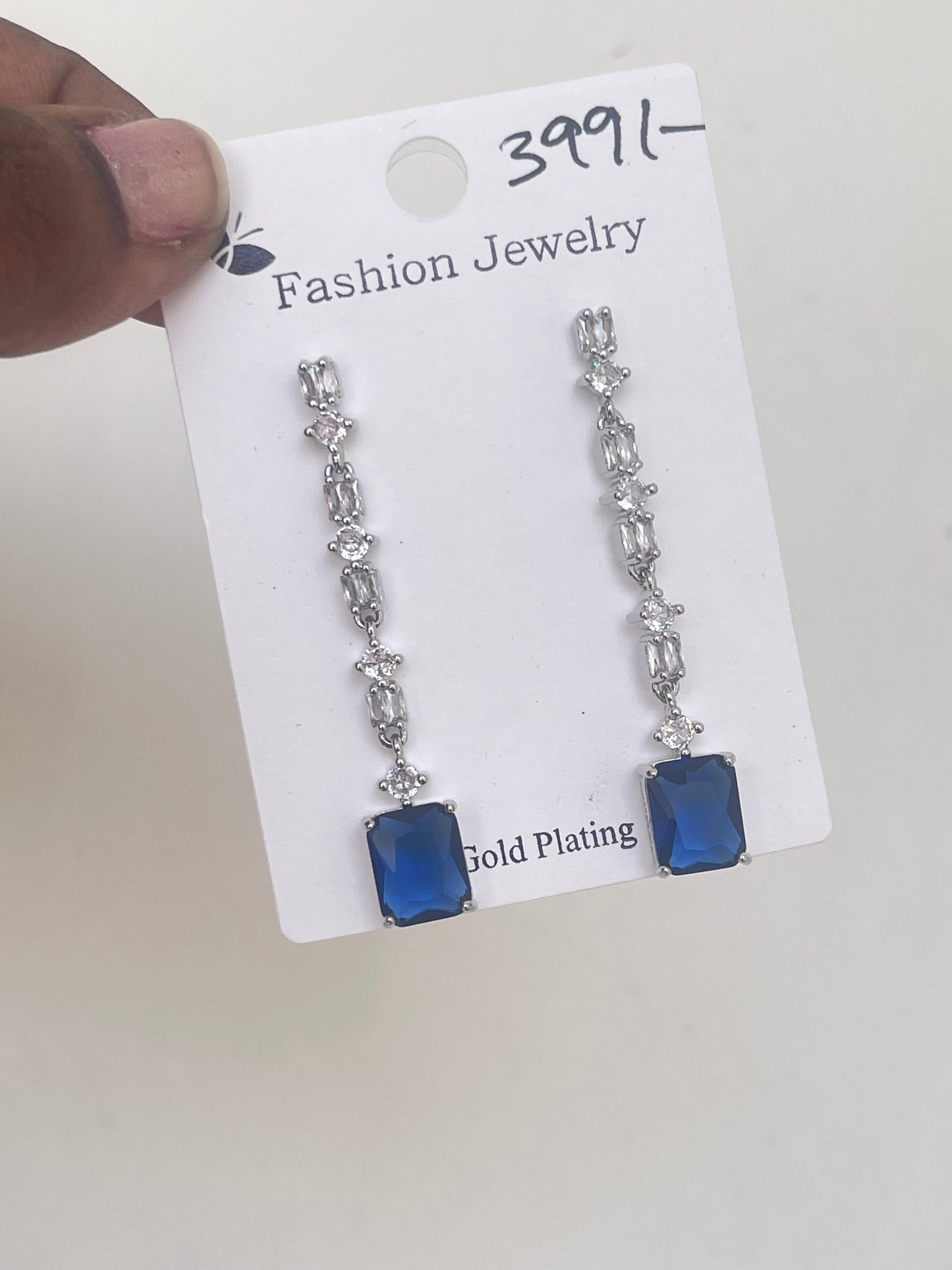 Zircon hanging earrings in blue and red