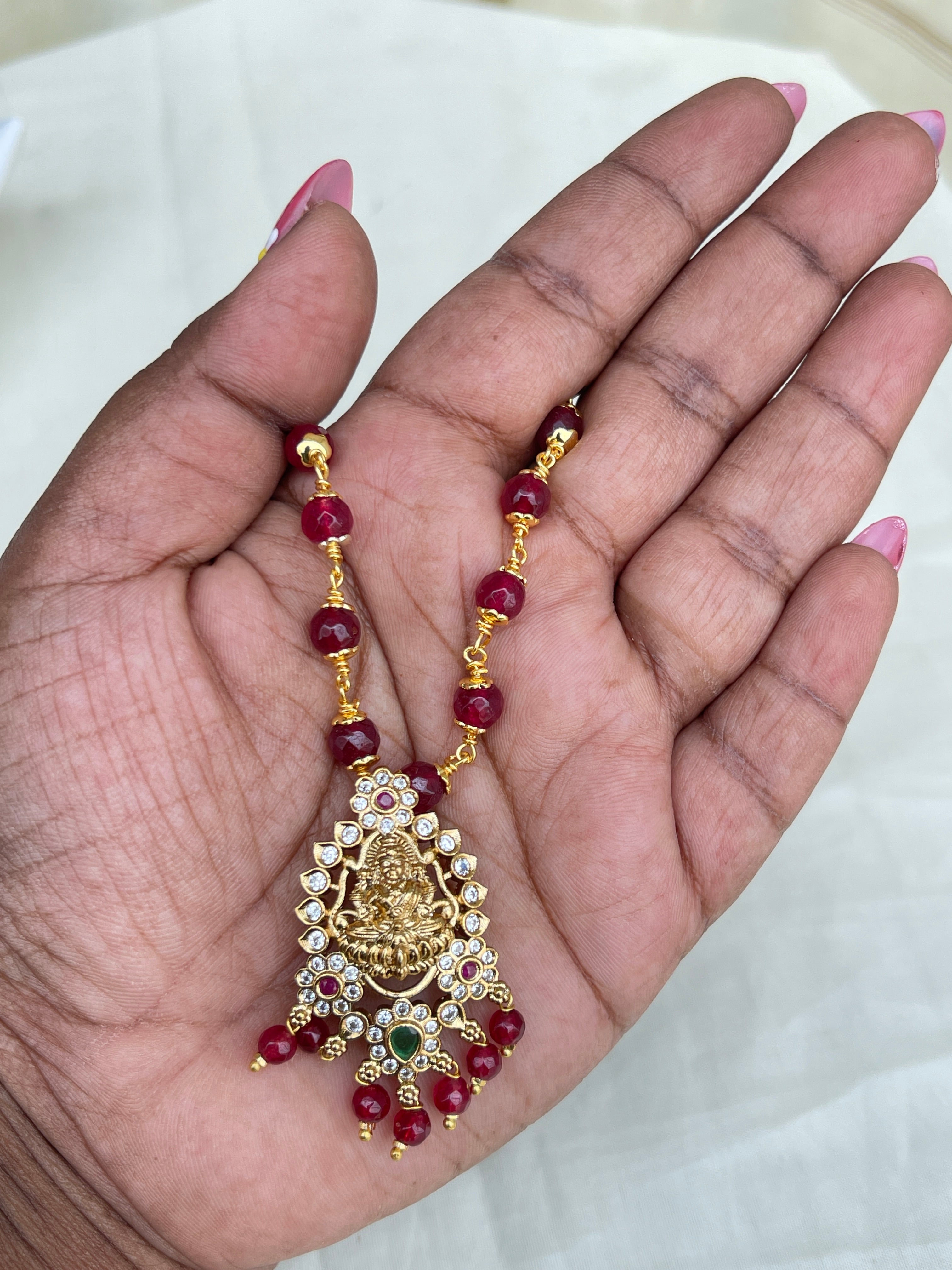Green ruby Circle beads with kattu theega along with Lakshmi Devi pendant