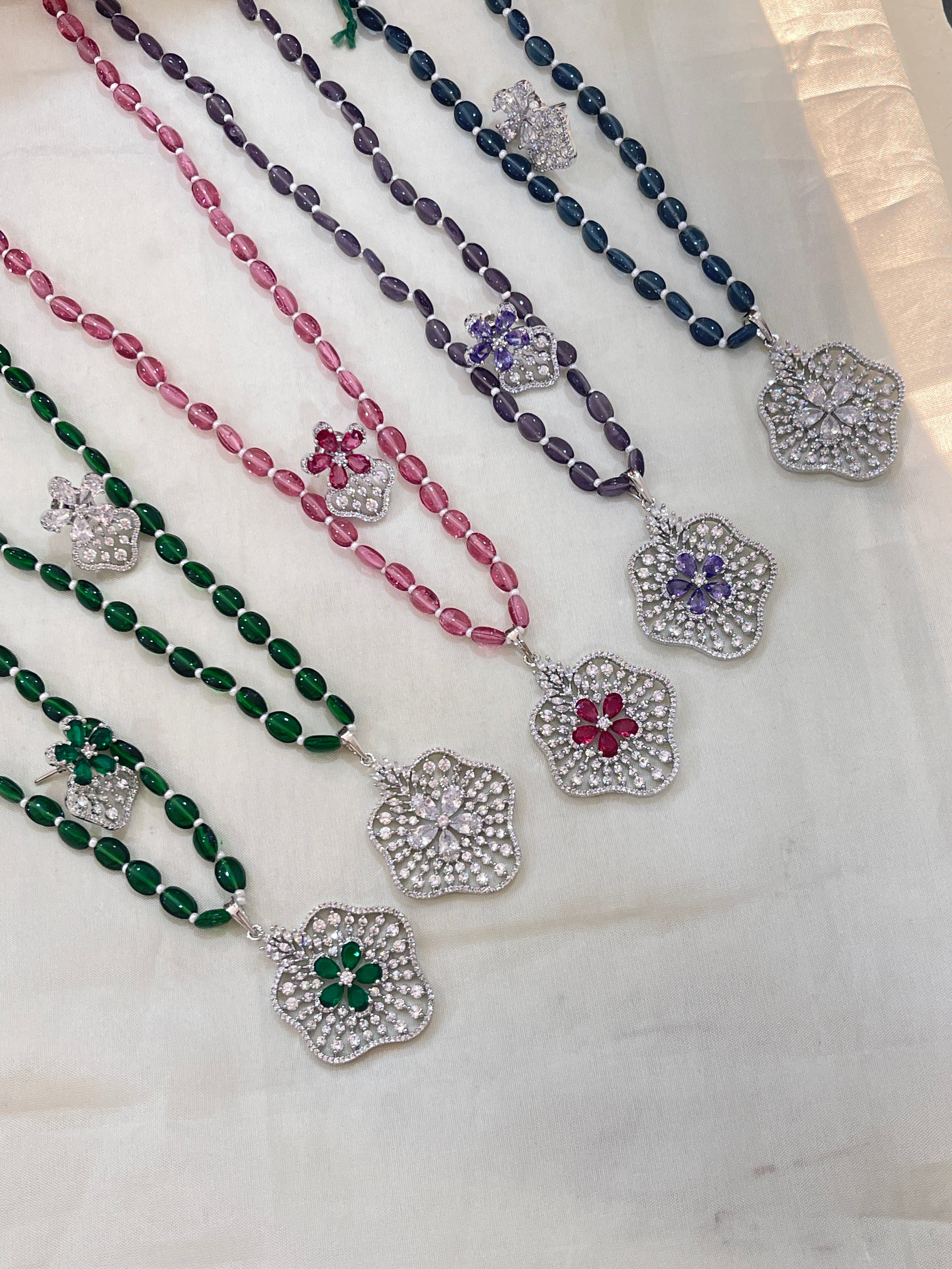 Beads with diamond finish pendent
