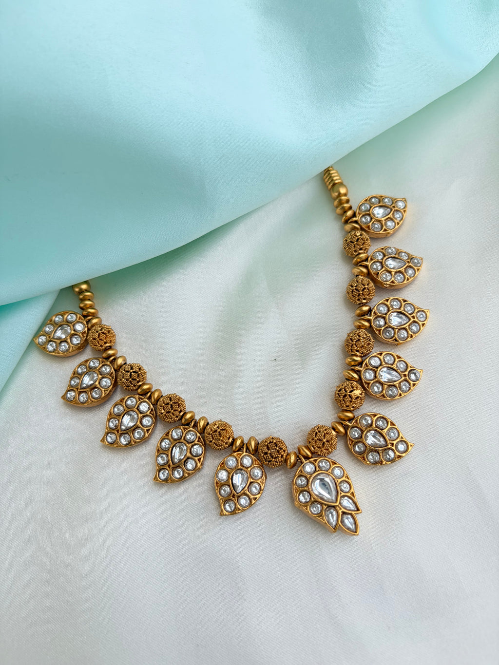 2-in-1 Dual-Sided antique gold Mango motif neckset with Ruby, Emerald, and kundan Stones Ns946