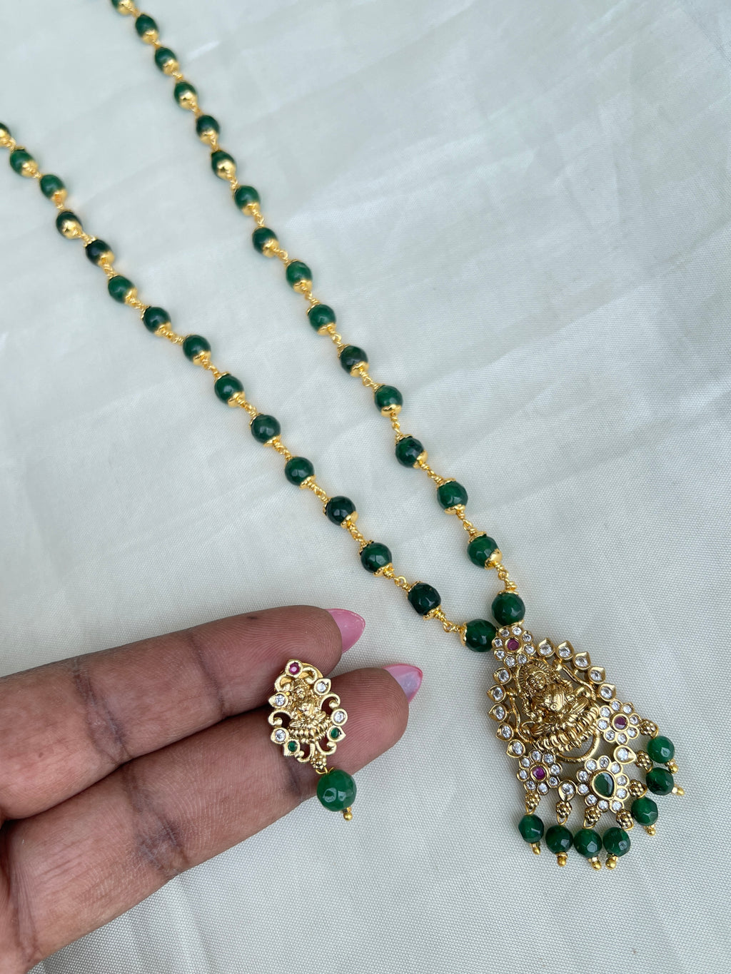 Green ruby Circle beads with kattu theega along with Lakshmi Devi pendant
