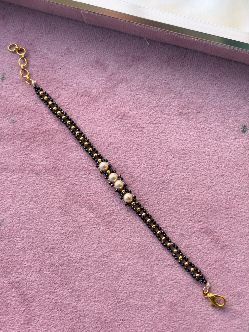 Br0014 Crystal black bead and gold balls with pearls
