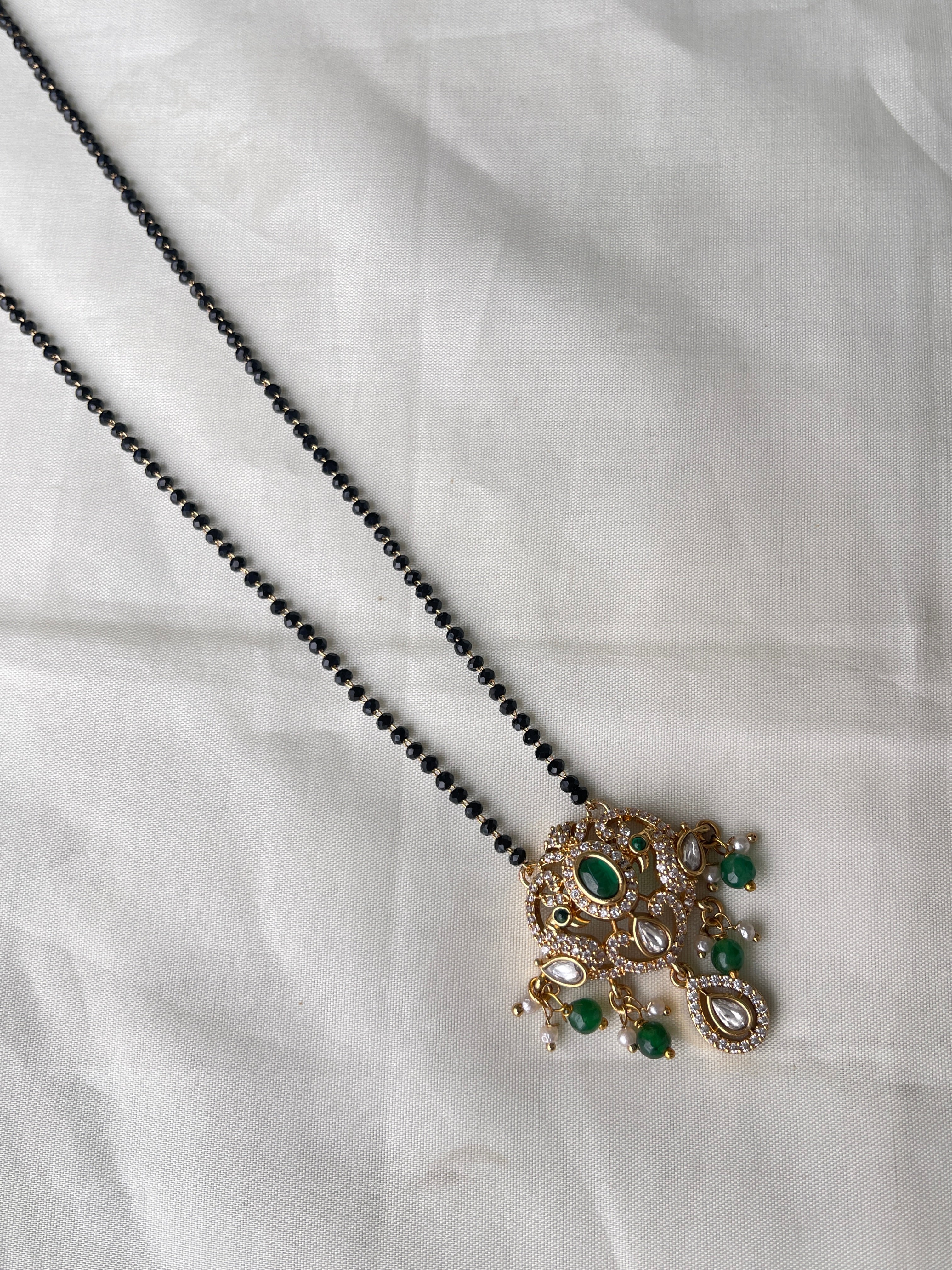 Dual peacock moissanite single line blackbeads