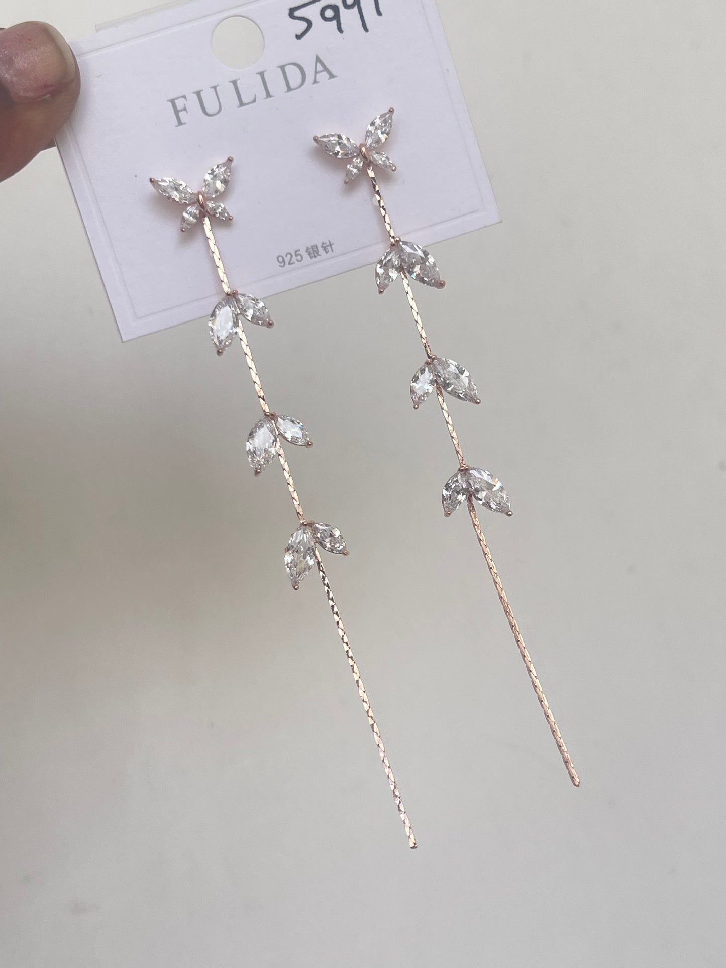 Butterfly tassels in silver and rosegold