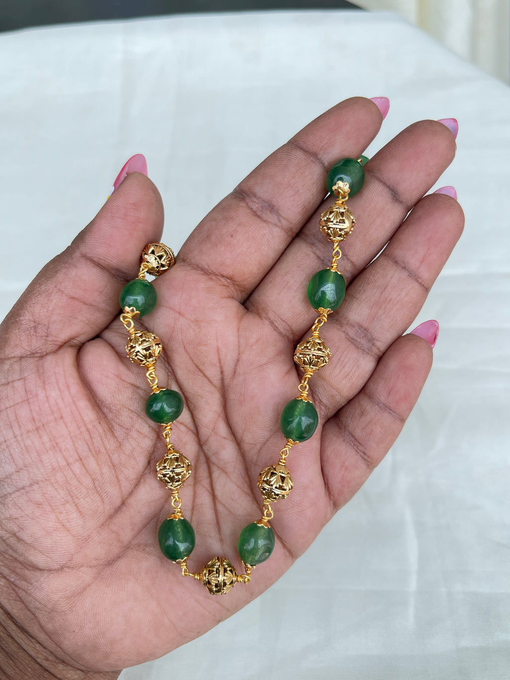 Green round beads with gold nakshi balls short size