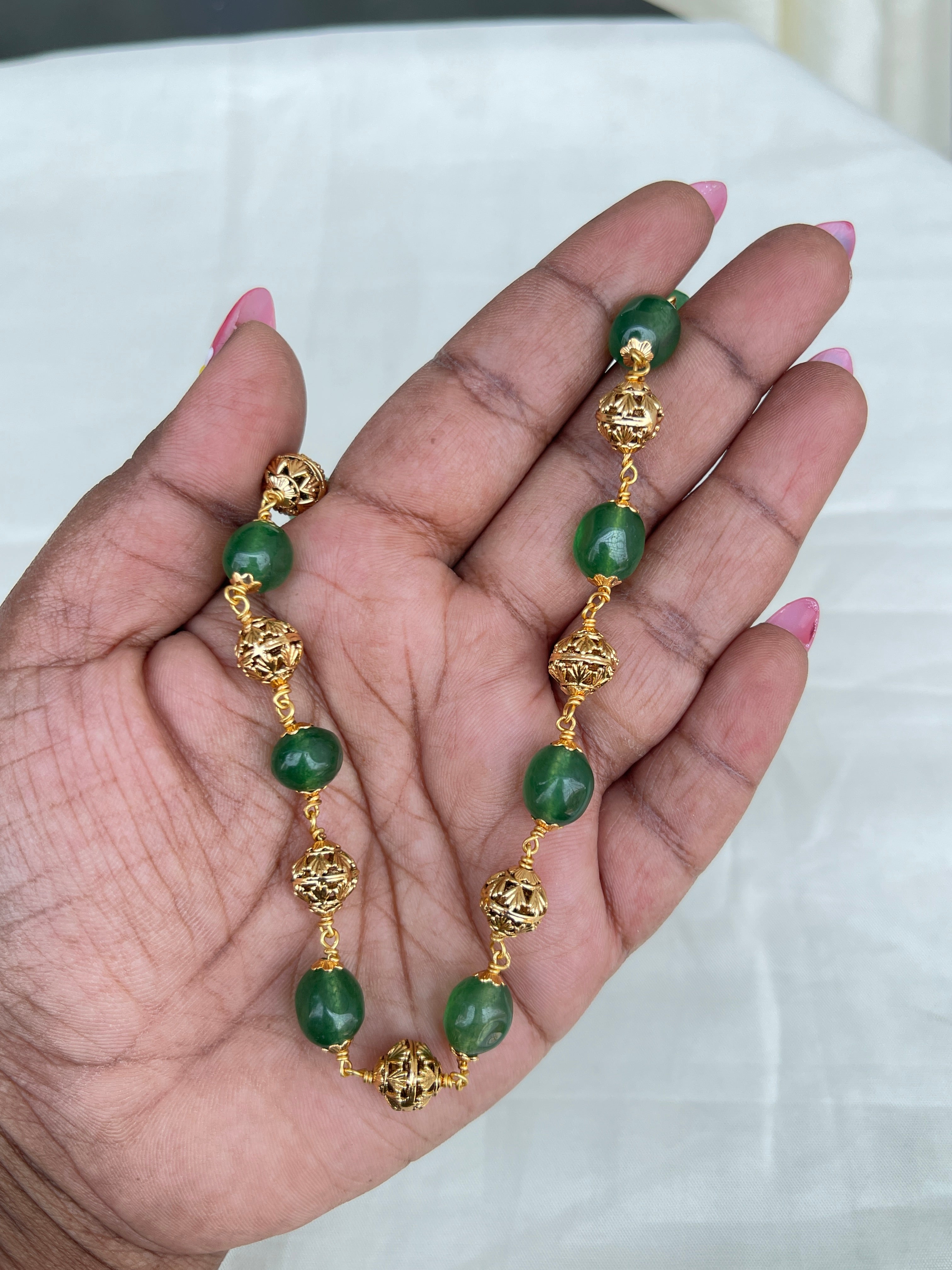 Green round beads with gold nakshi balls short size