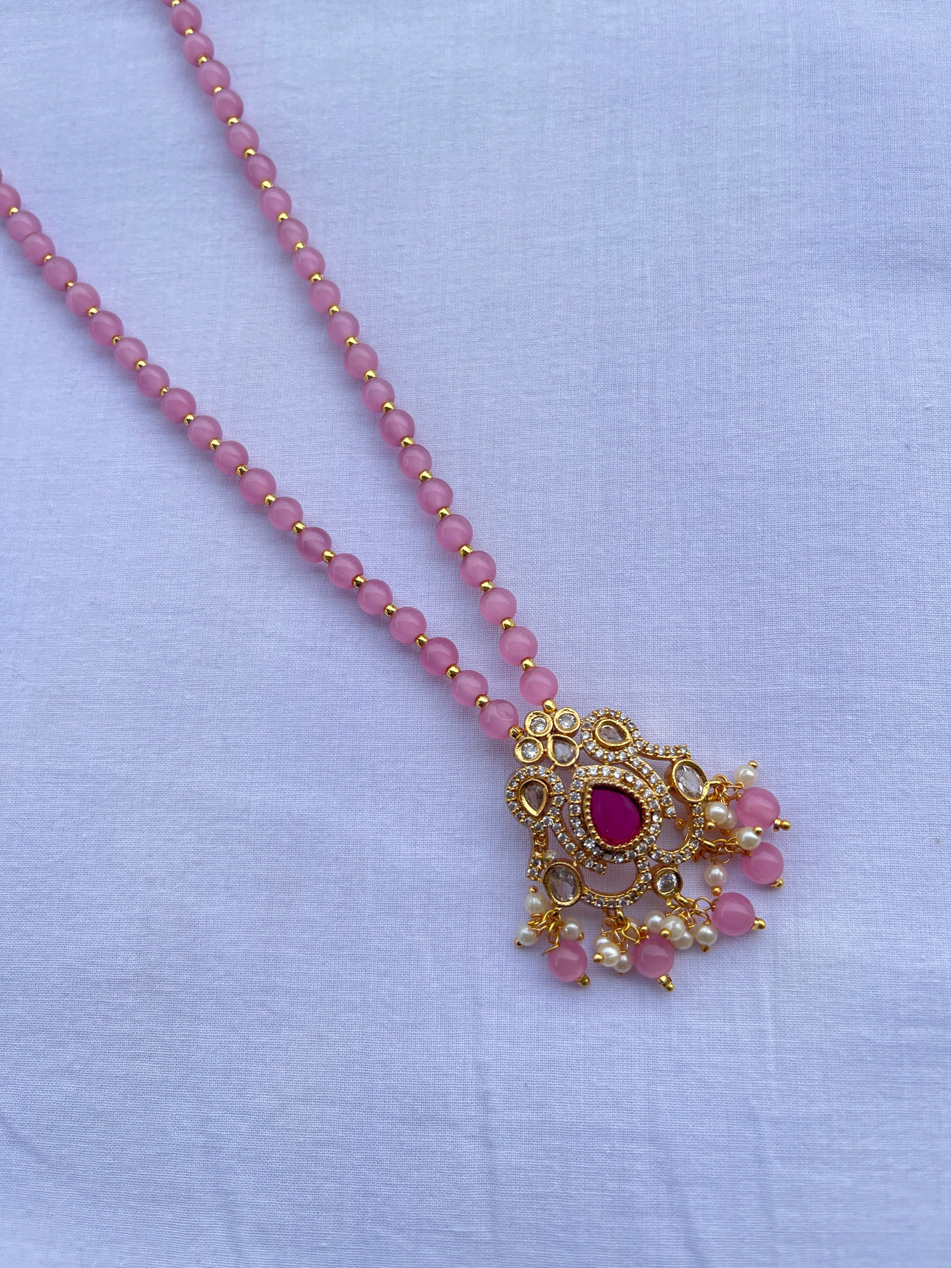 Light pink beads with uncut pendant