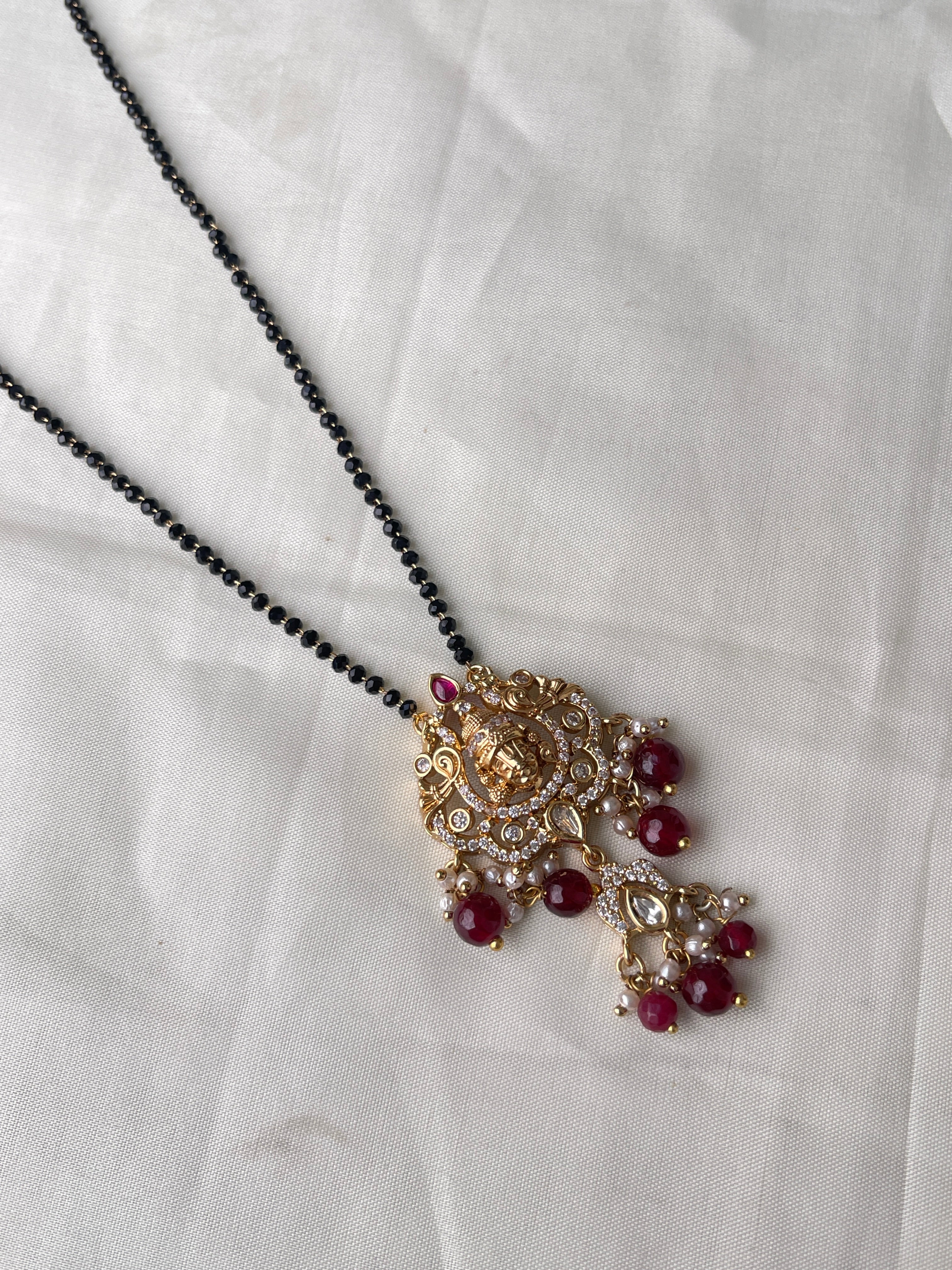 Single line short blackbeads with Lord Venkateswara pendant with moissanite stone