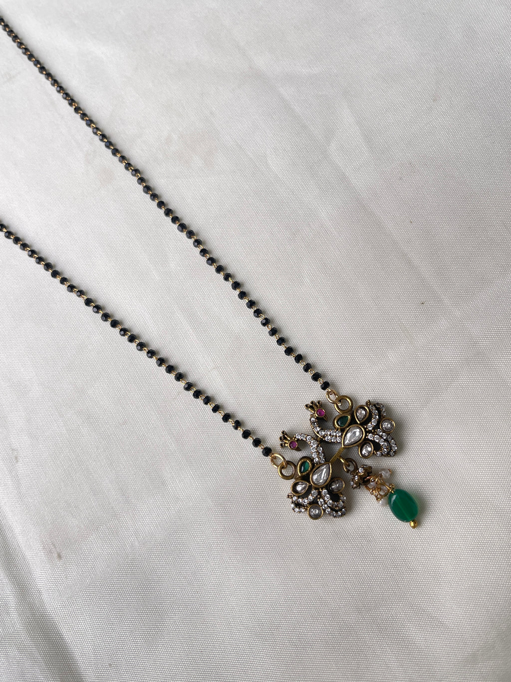 Dual peacock Victorian single line short blackbeads