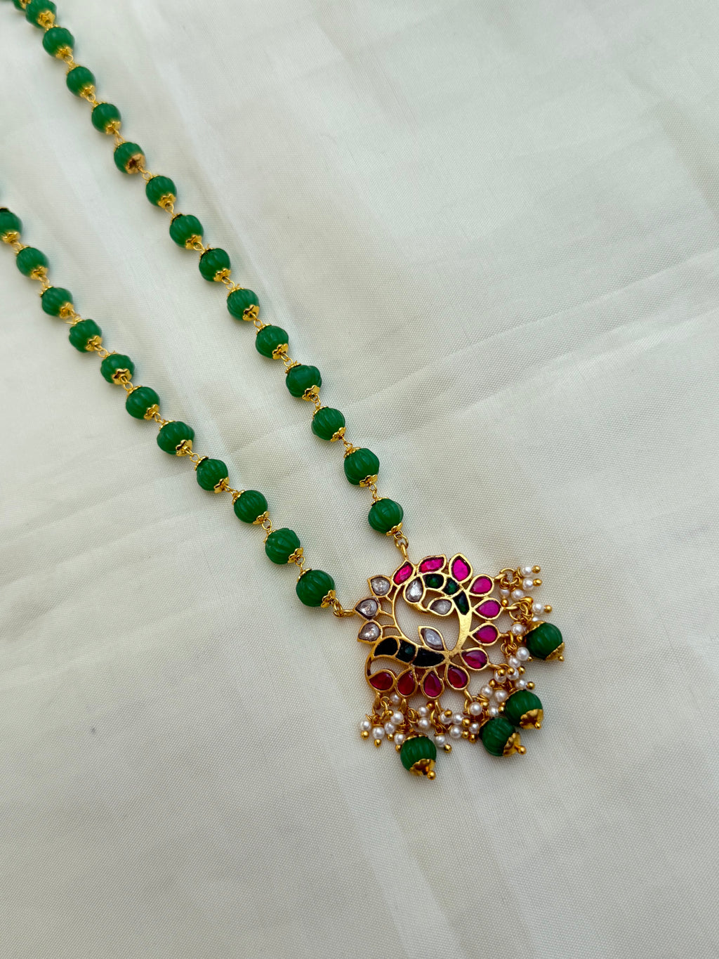 Jk009 pumpkin beads with jadau Kundan pendant
Size(20-22) inches approximately