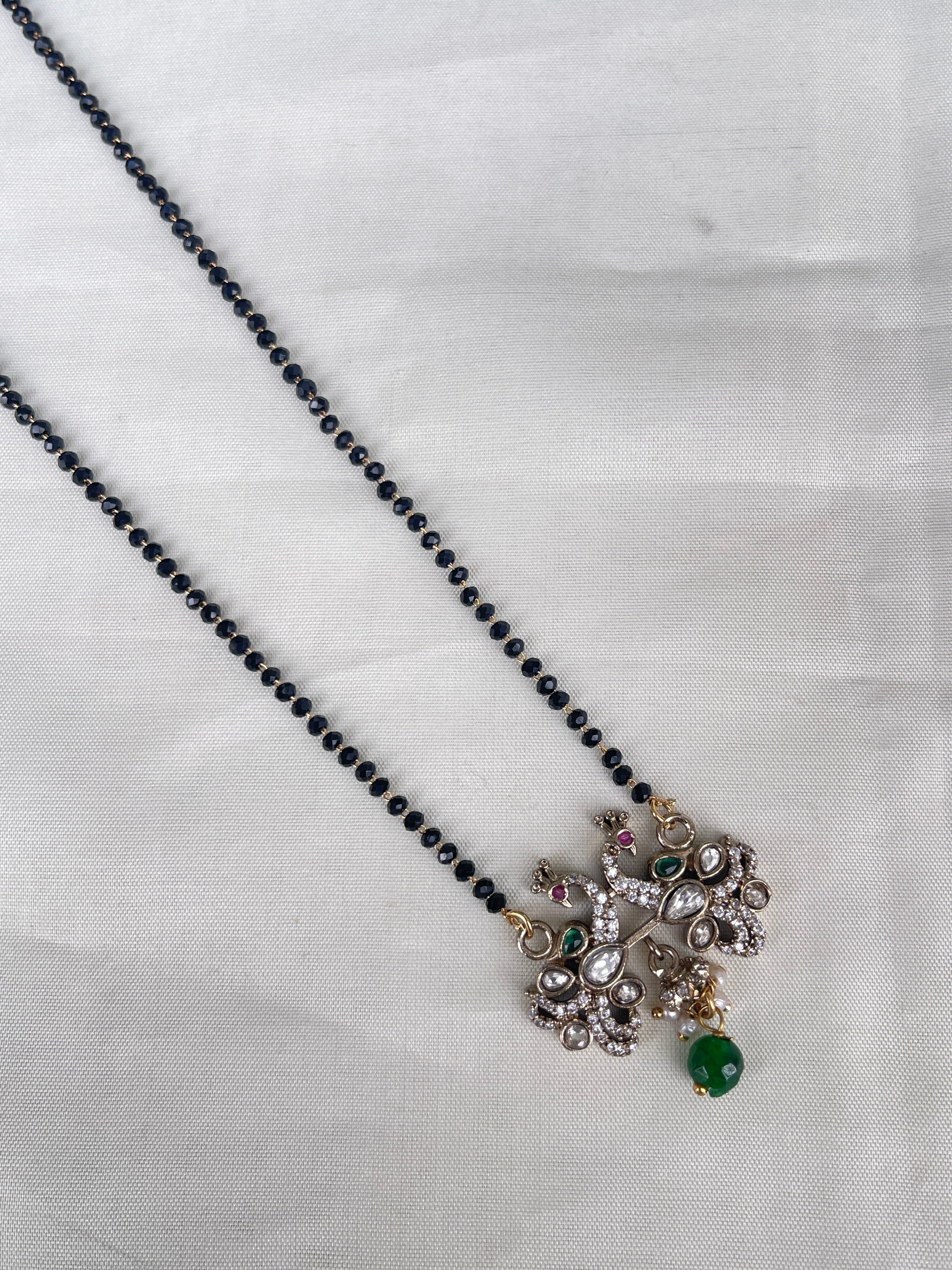Single line blackbeads with peakock pendent bb1712
