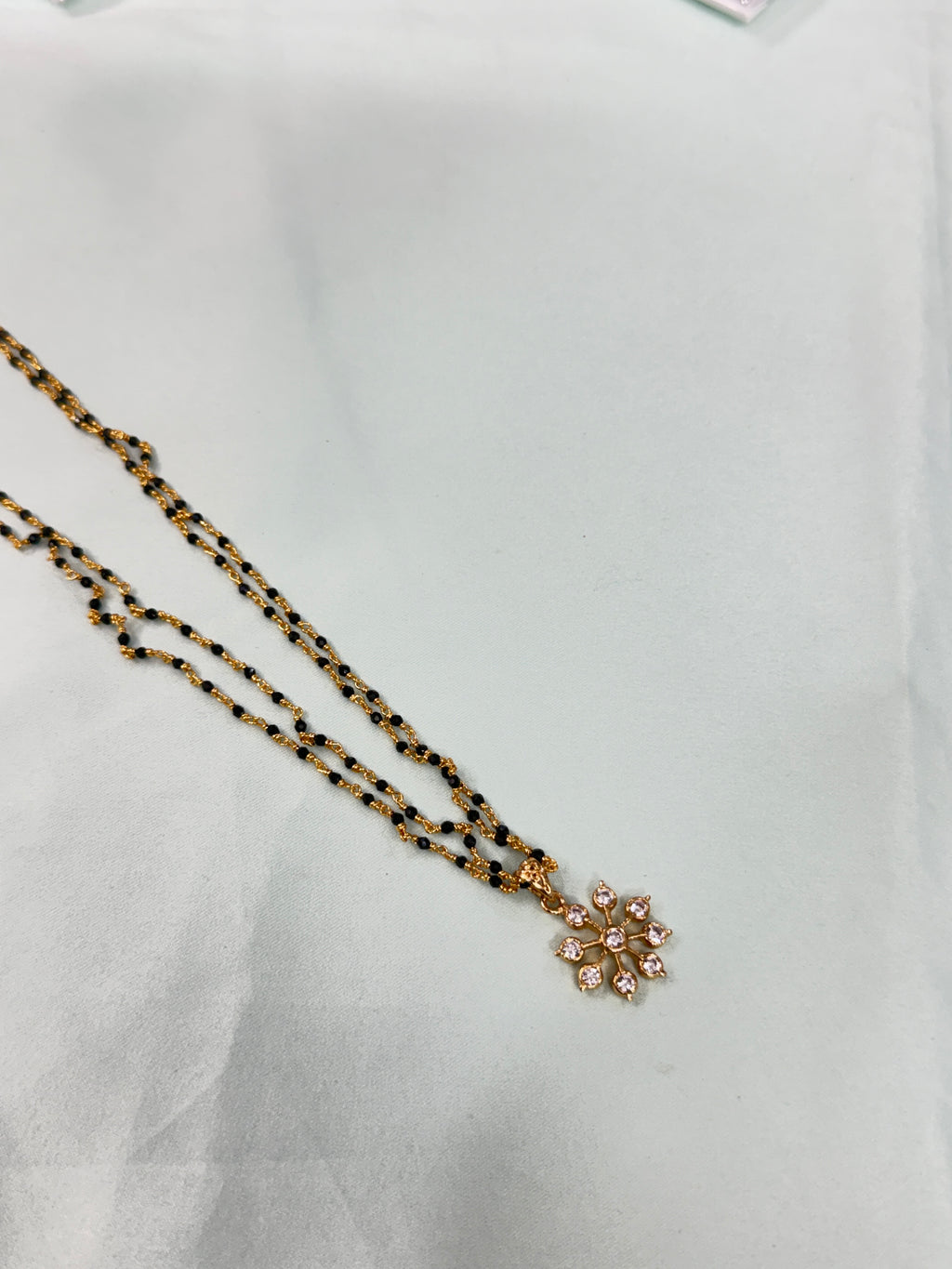 Bb220 micro gold 2 layers black bead with Panchaloham pendant 18 inches black beads