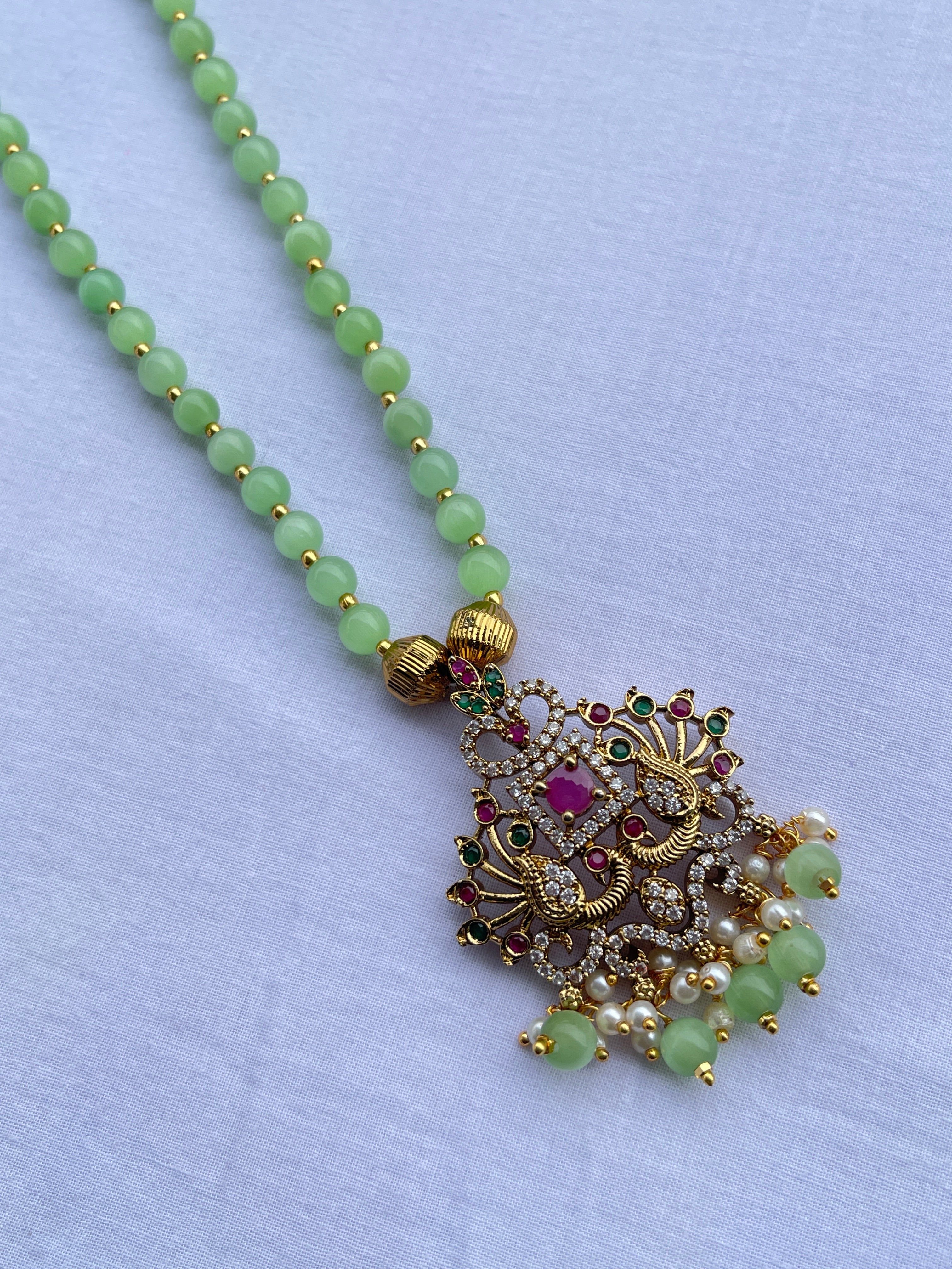 Multi peacock pendant single line beads chain in light green and light pink