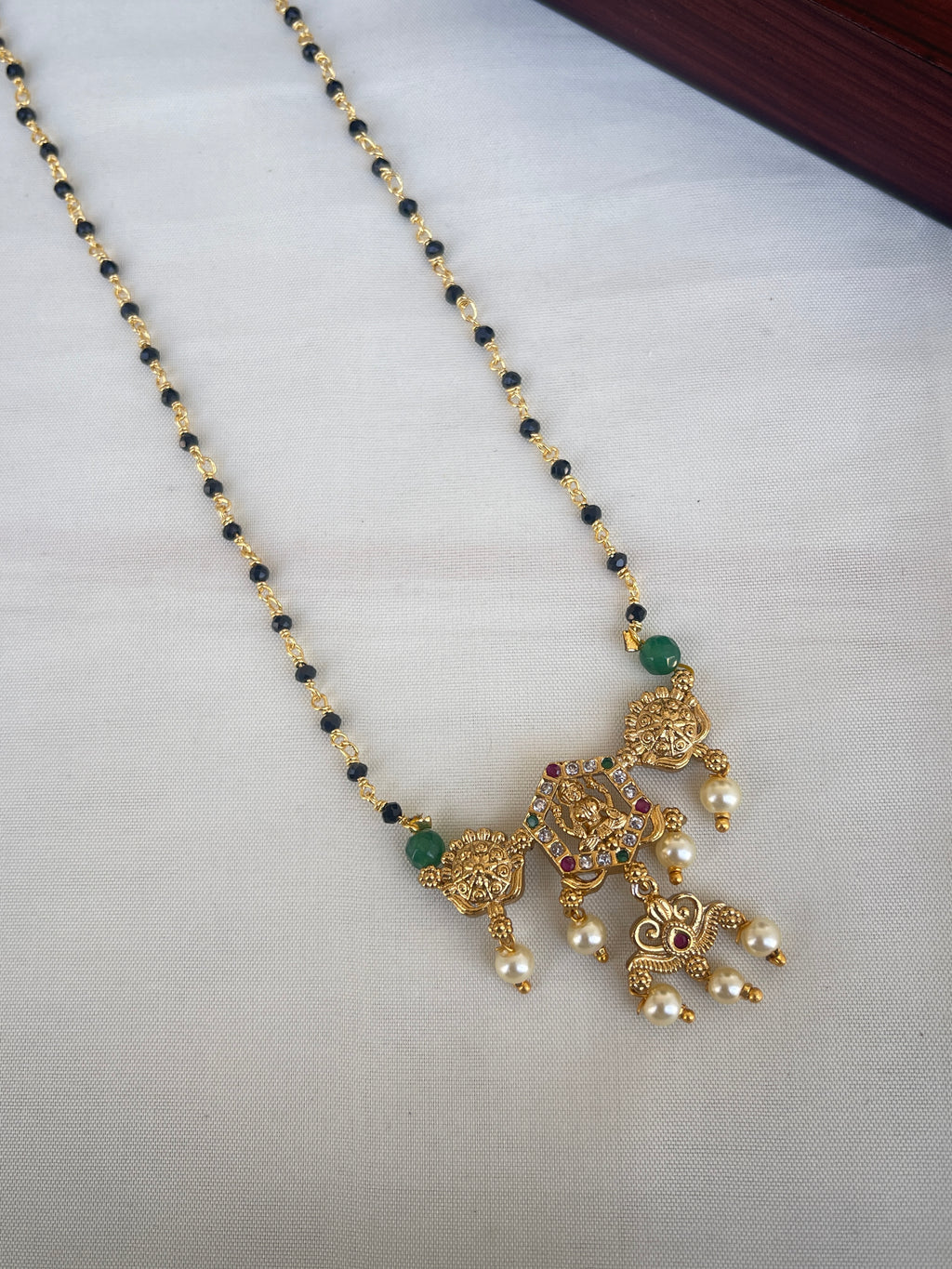 Single line short blackbeads with Lakshmi Devi pendant