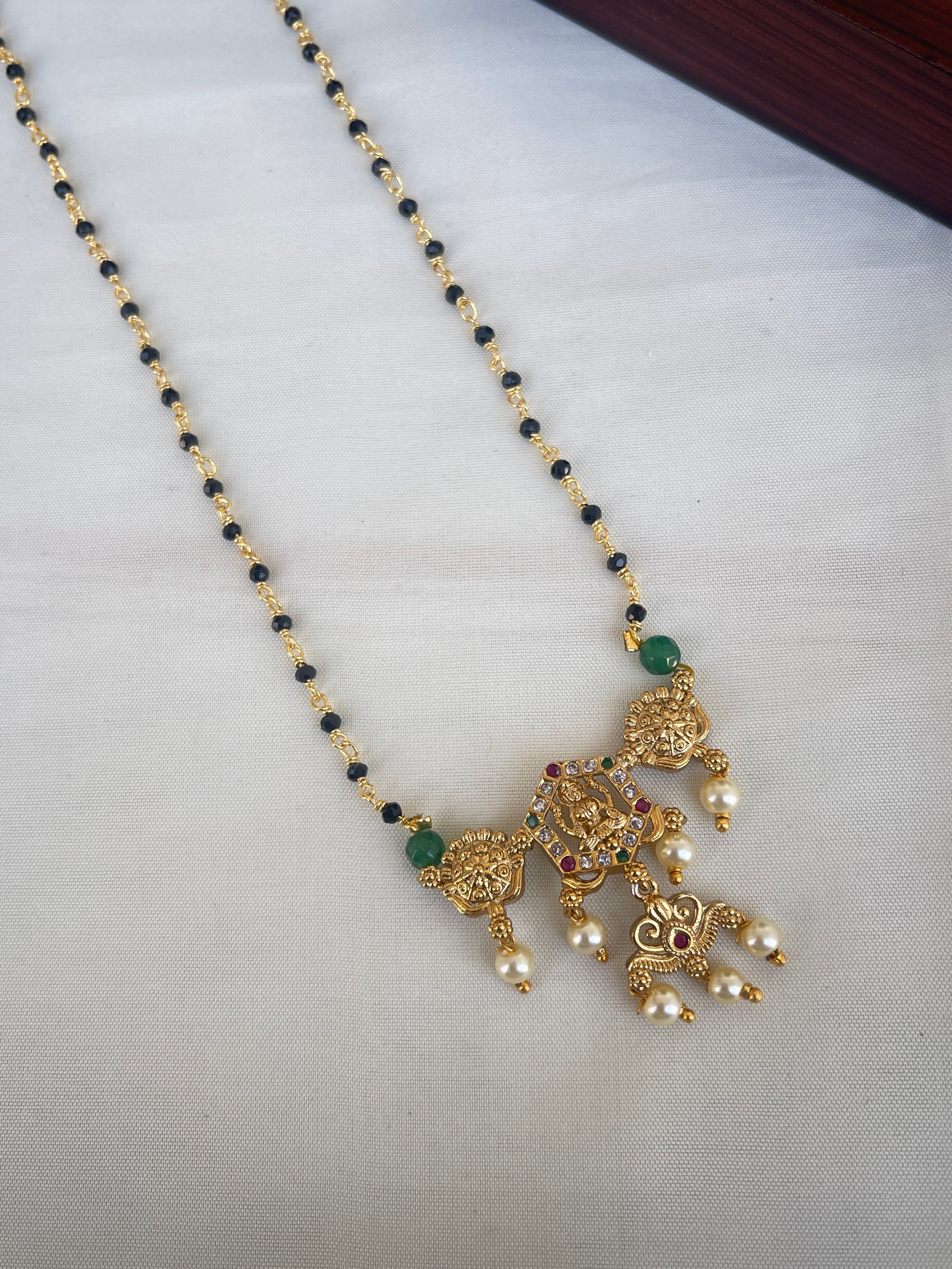 Single line short blackbeads with Lakshmi Devi pendant