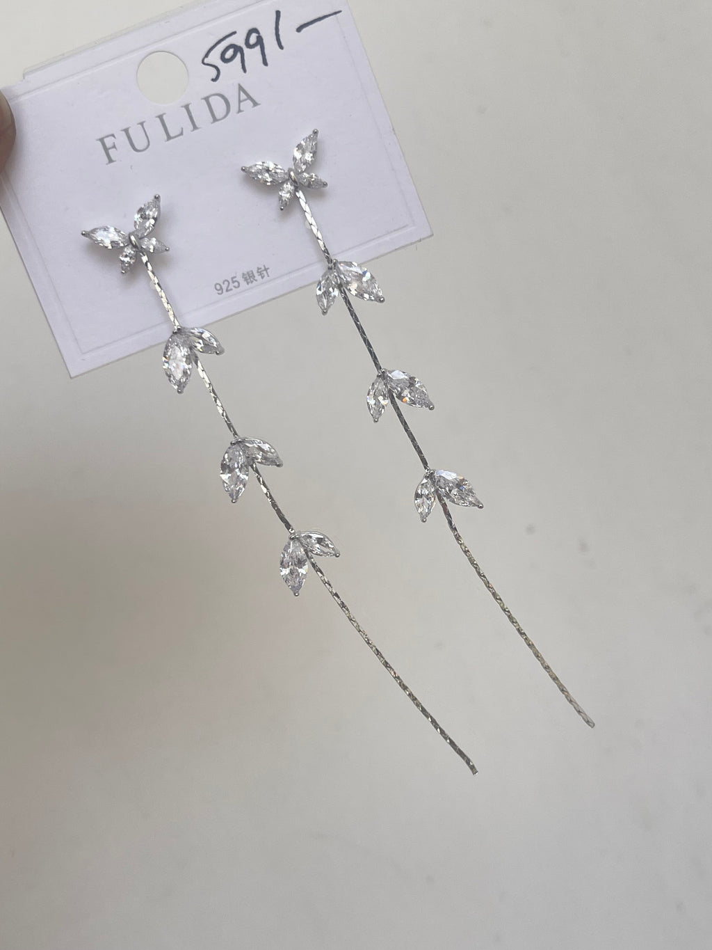 Butterfly tassels in silver and rosegold