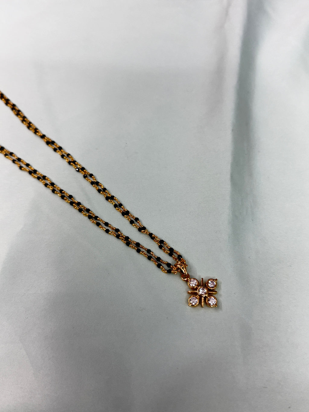 Bb222 micro gold 2 layers black bead with Panchaloham pendant 18 inches black beads