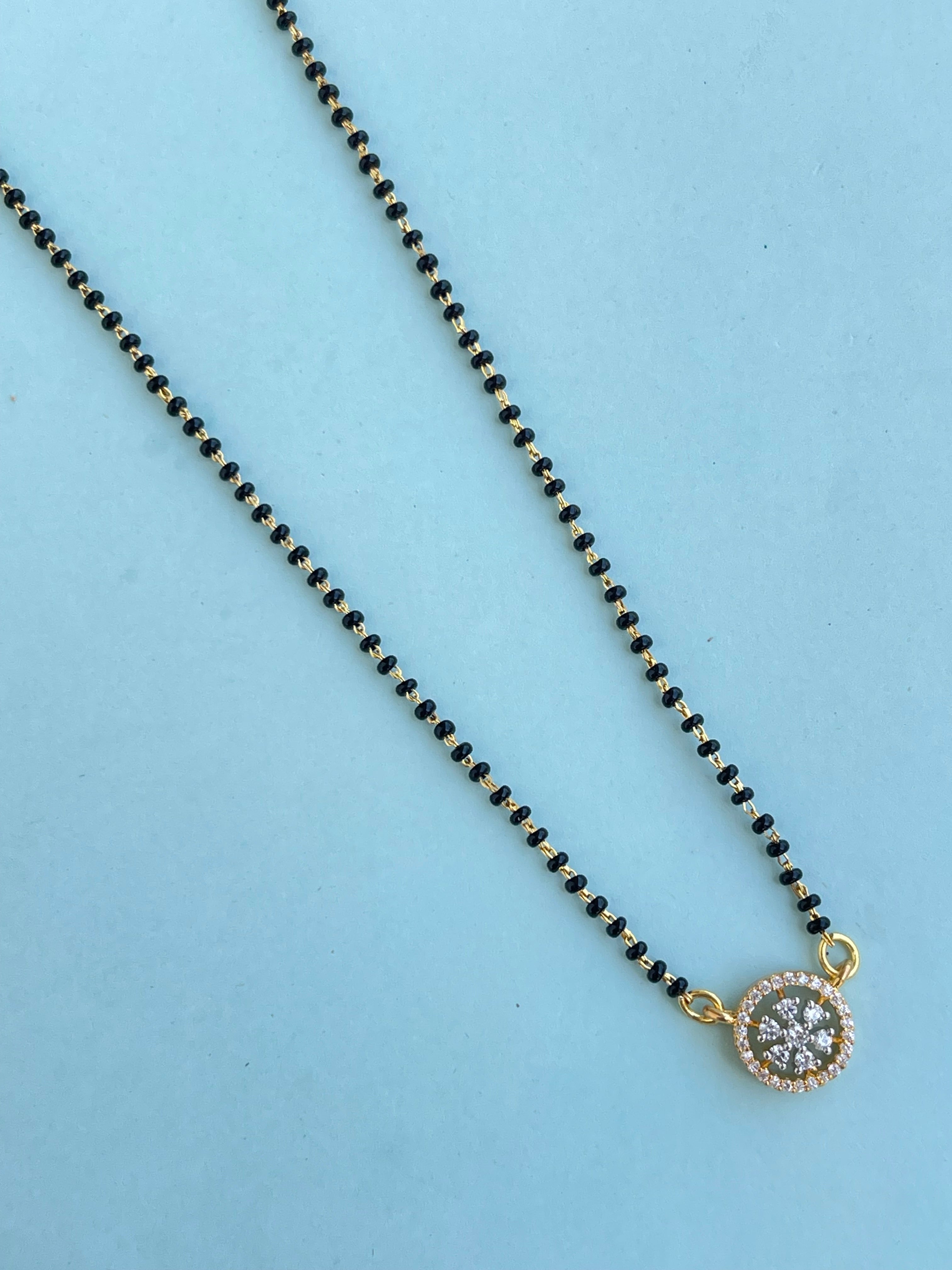 Single line blackbeads with diamond pendant and earrings (mangalsutra)