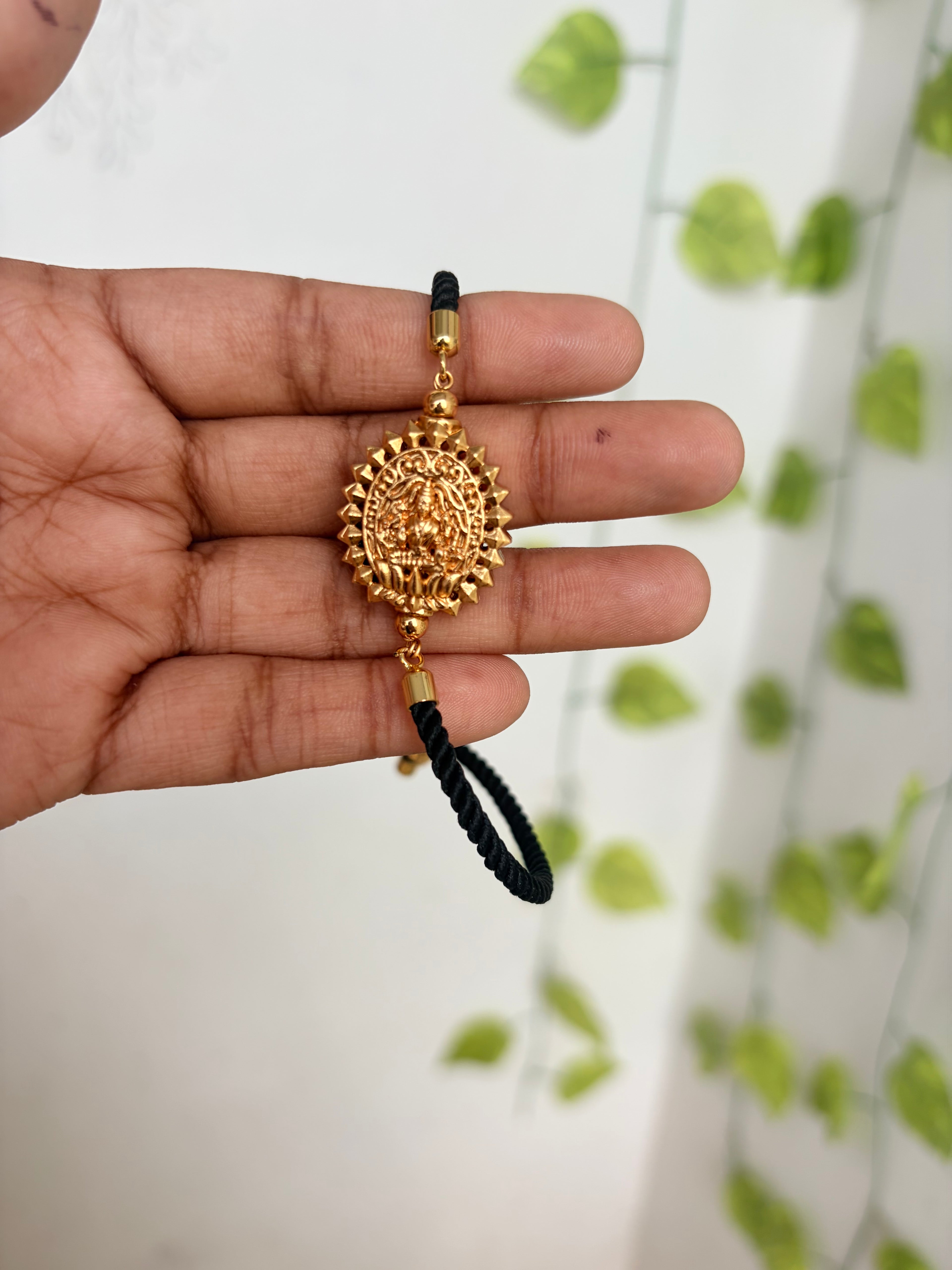 Lakshmidevi design black thread adjustable rakhi bracelet br581