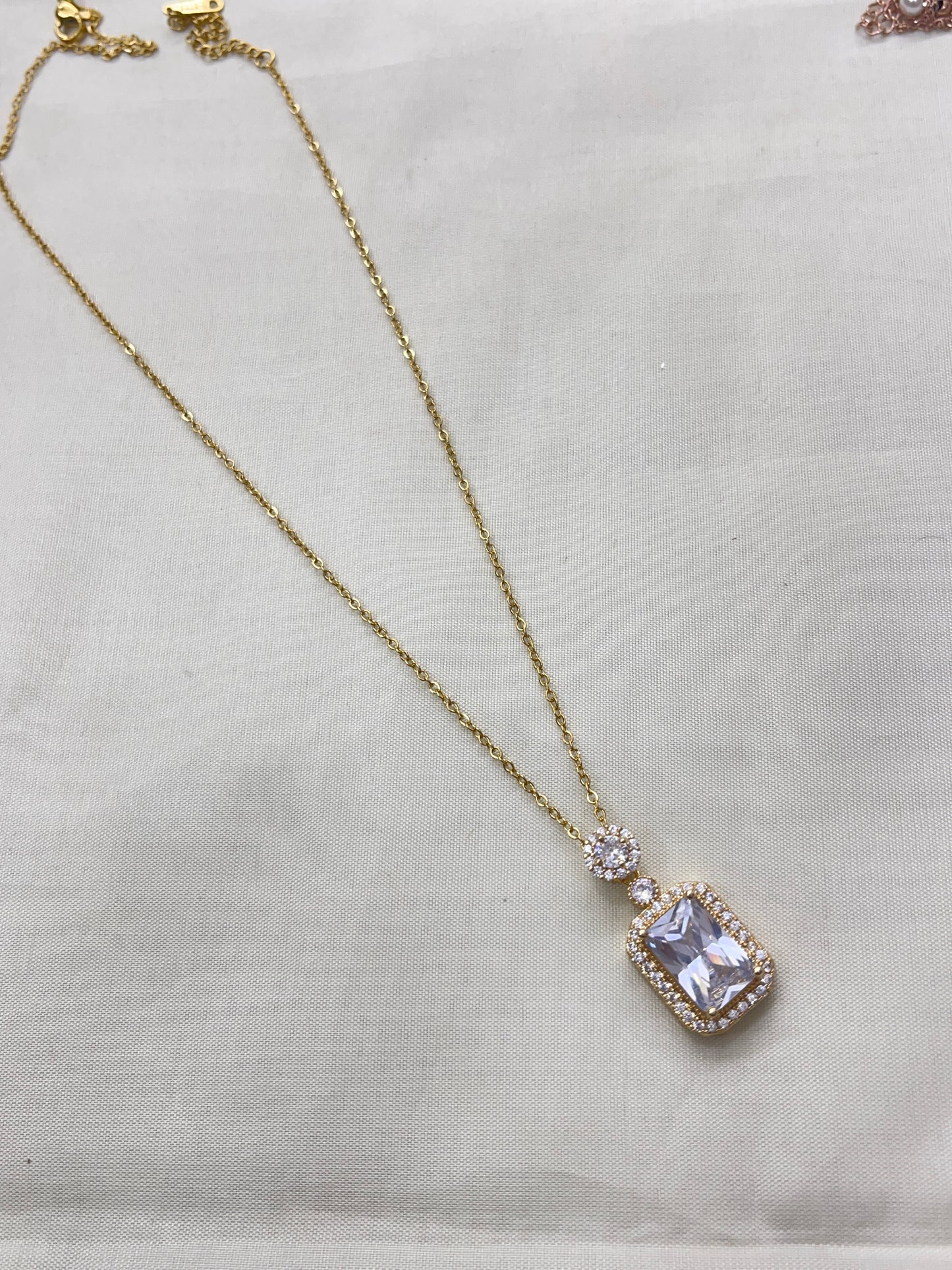 White stone pendant neckline