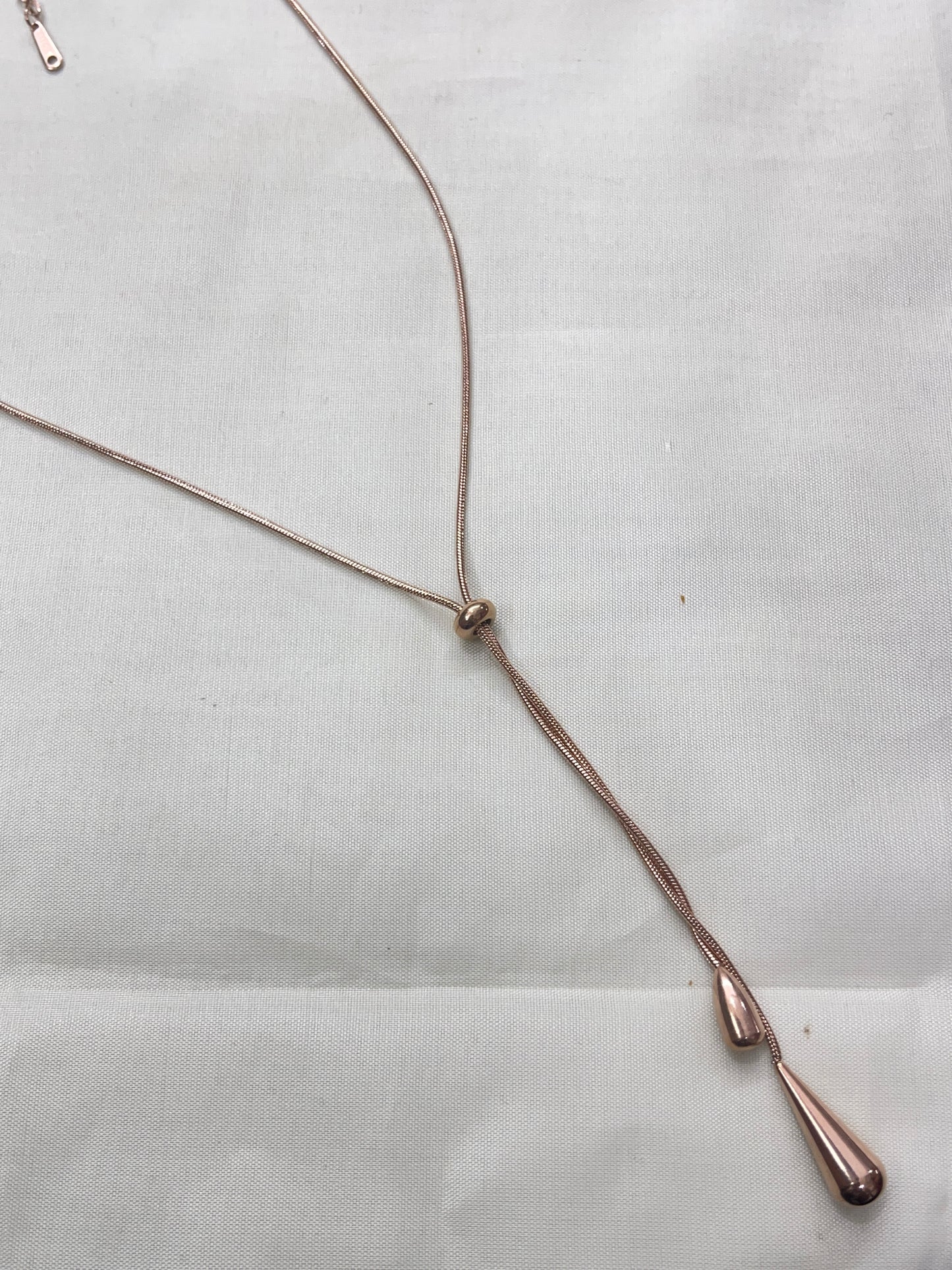 Adjustable rose gold drop neckline