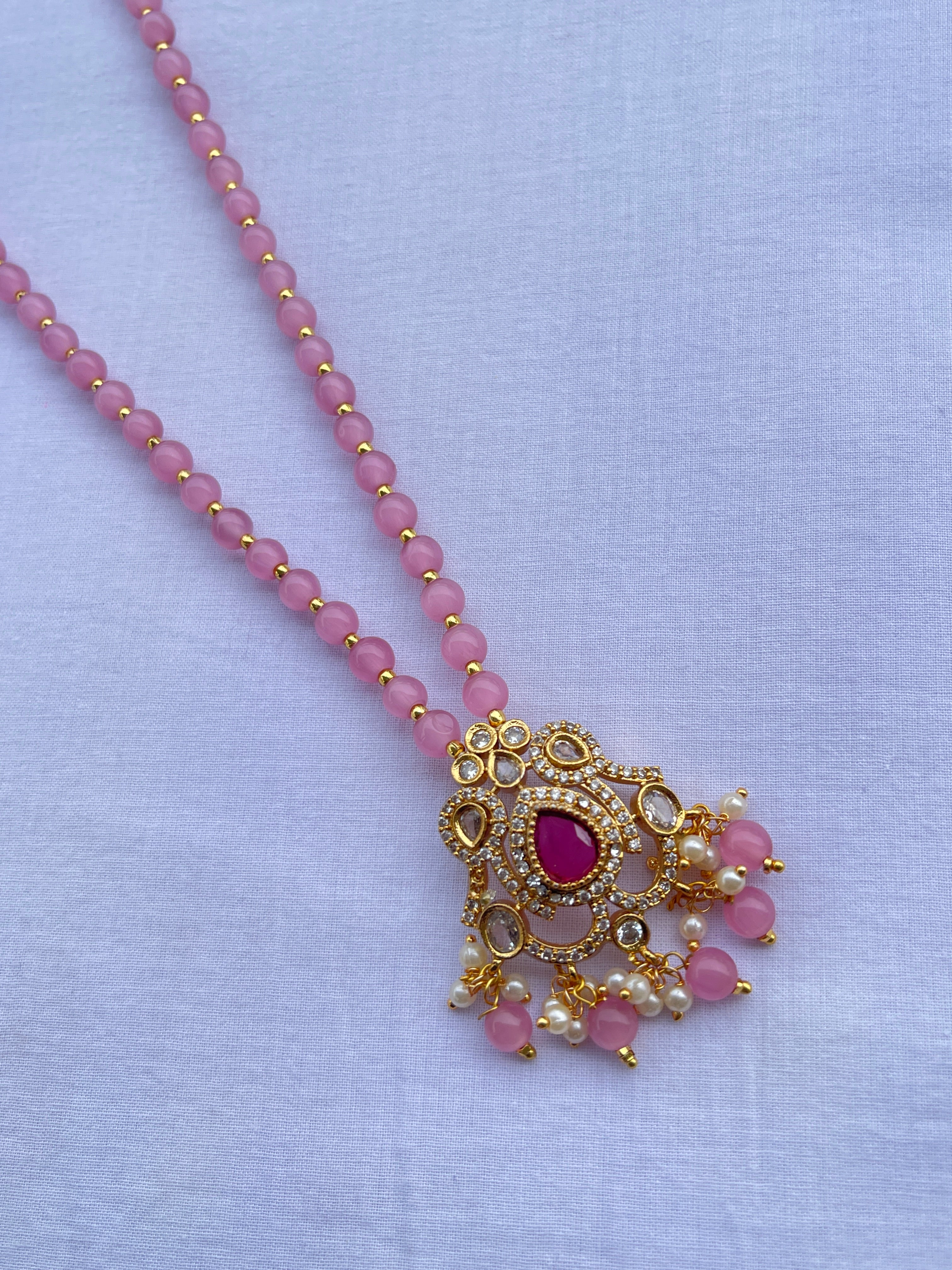 Light pink beads with uncut pendant