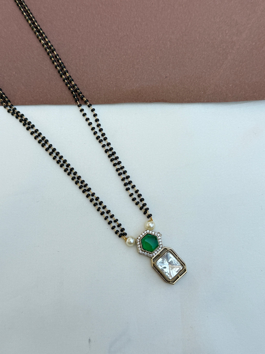 Bb064 2 lines 18 inches blackbeads with green and white stone pendent