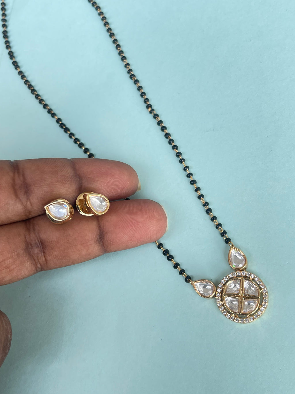 Kundan pendent and earrings 
Single line 18 inches blackbeads bb1636