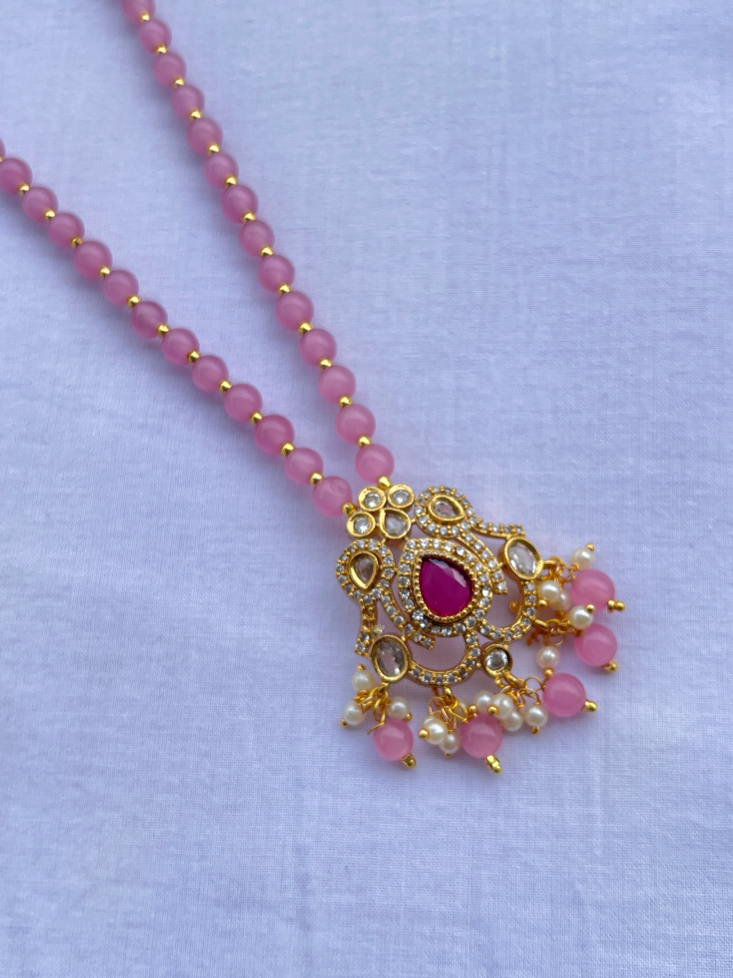 Light pink beads with uncut pendant