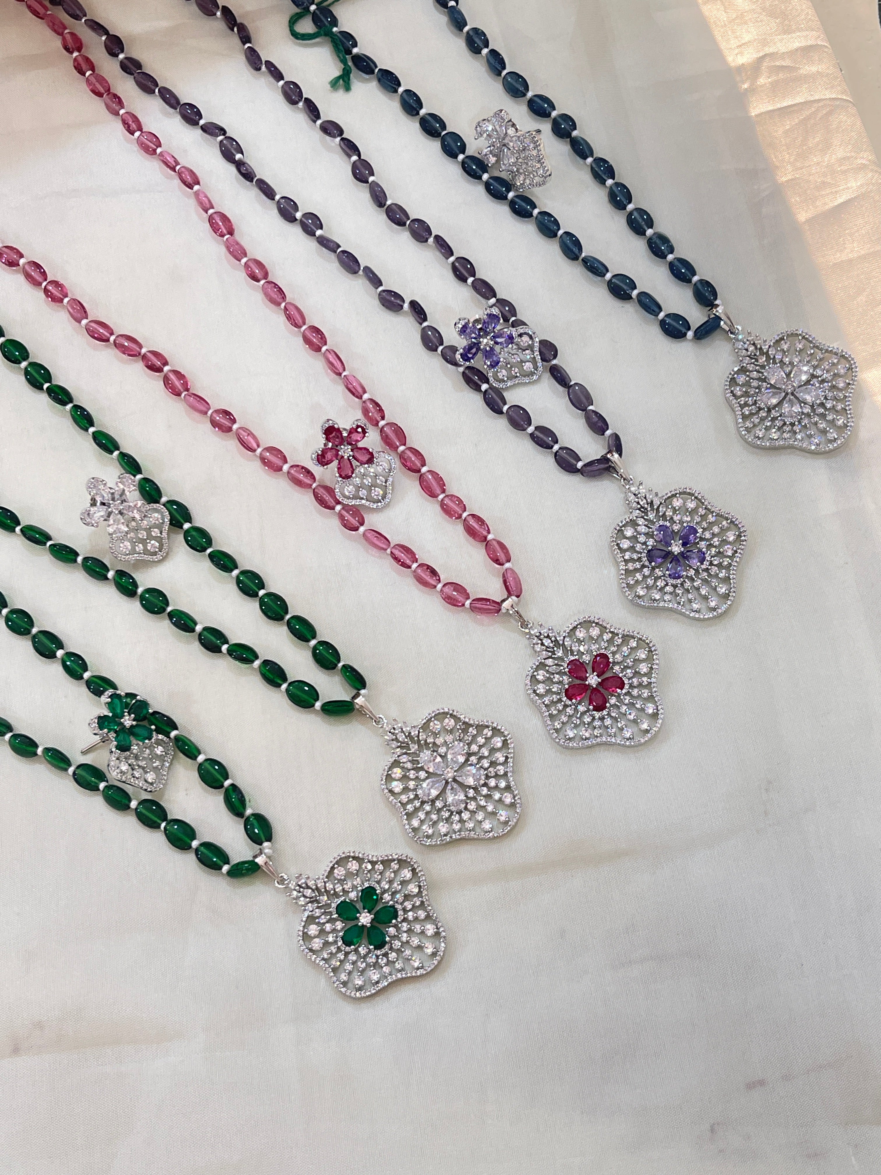 Beads with diamond finish pendent
