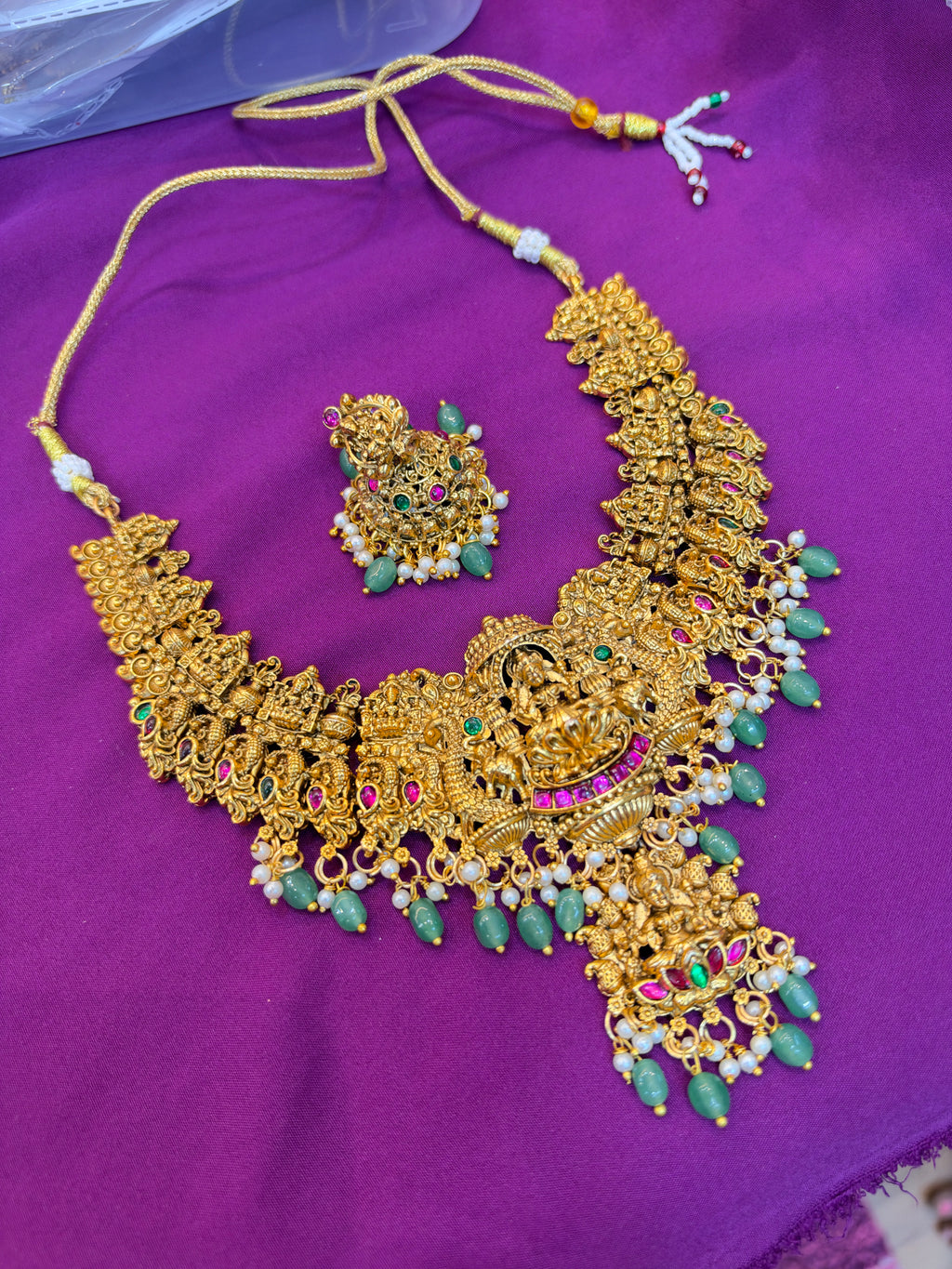 Ns4000 Lakshmidevi pendants with green beads short Neckset with butta earrings