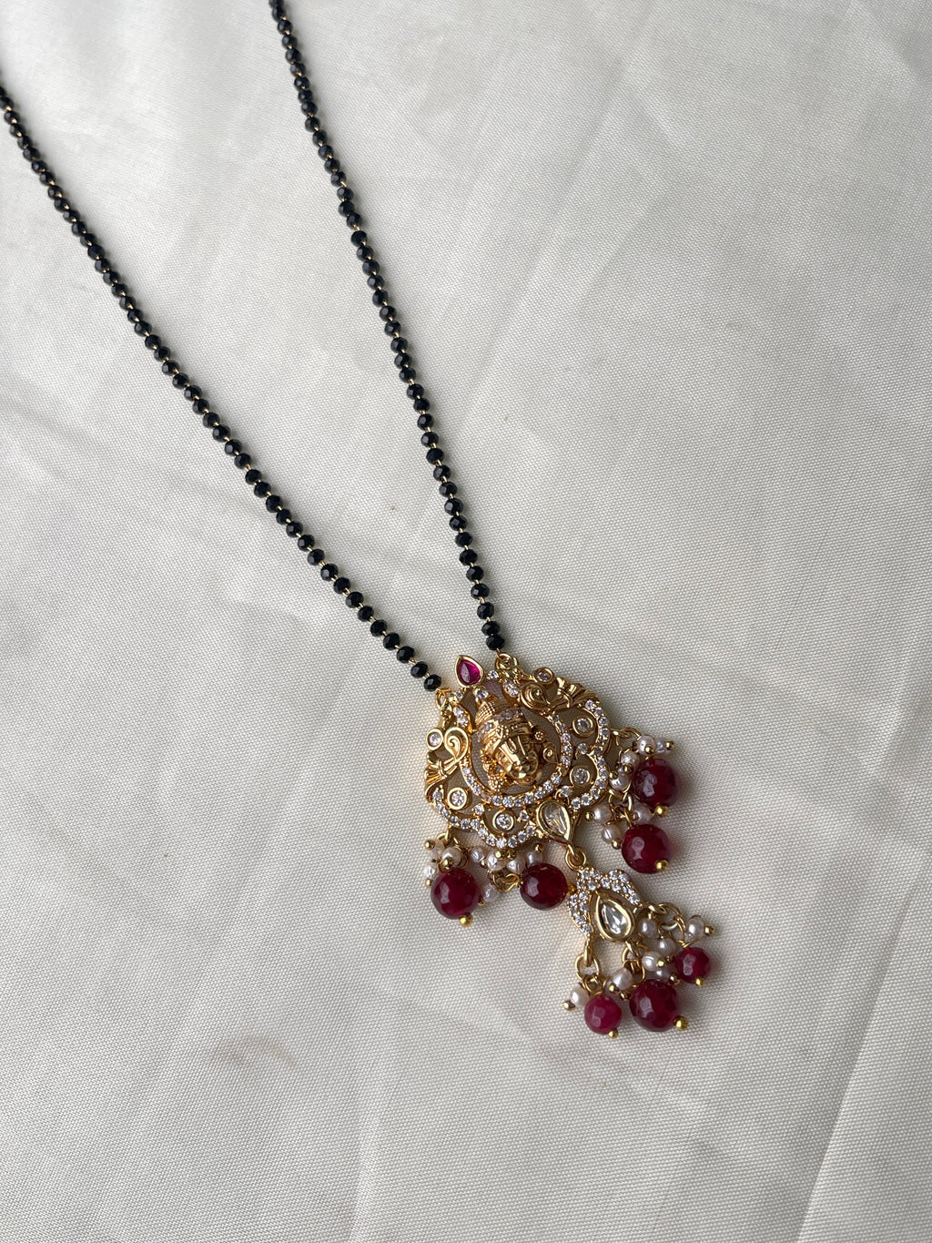 Single line short blackbeads with Lord Venkateswara pendant with moissanite stone