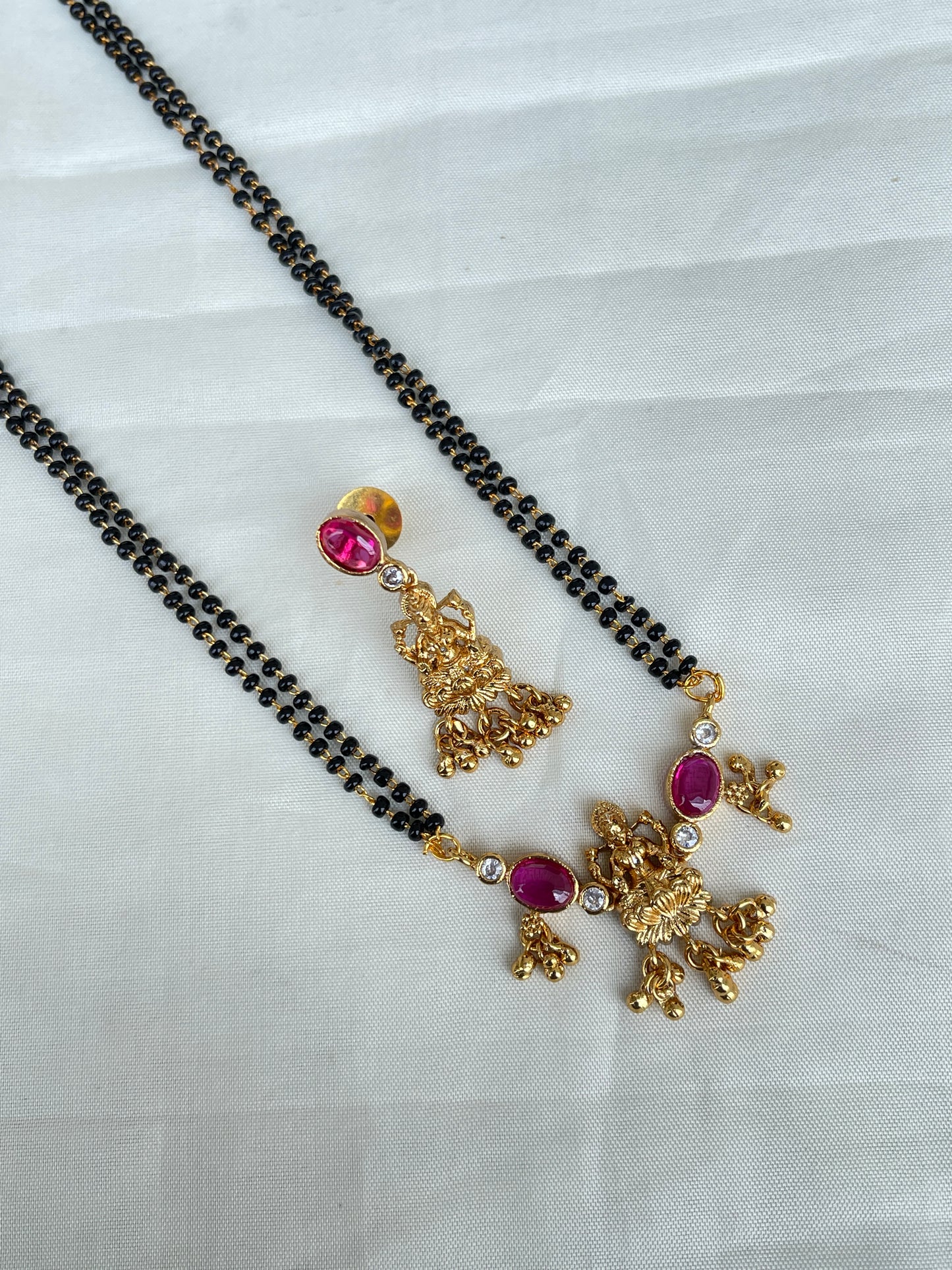 2 lines short blackbeads with lakshmi devi pendant and earrings