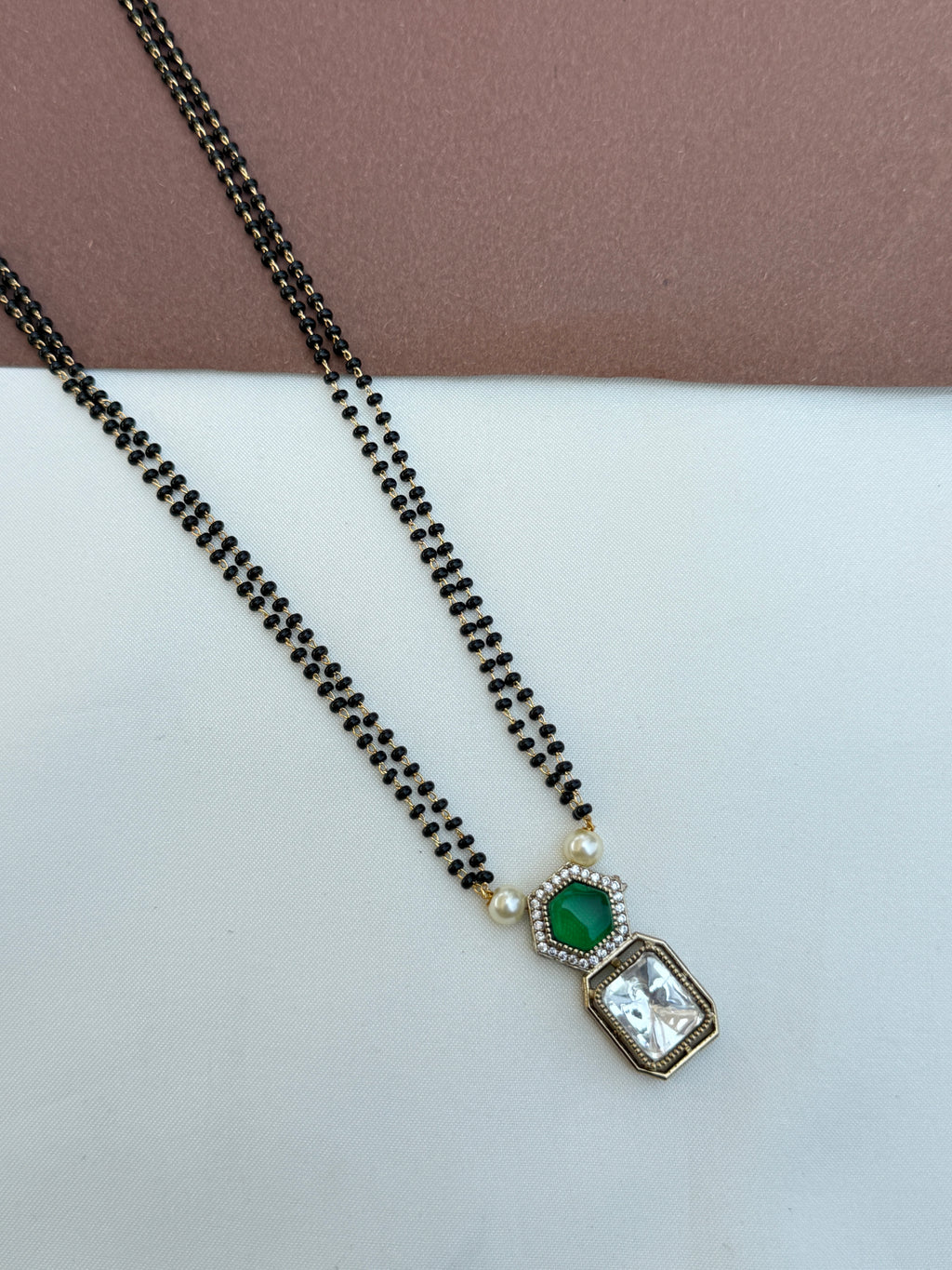 Bb064 2 lines 18 inches blackbeads with green and white stone pendent
