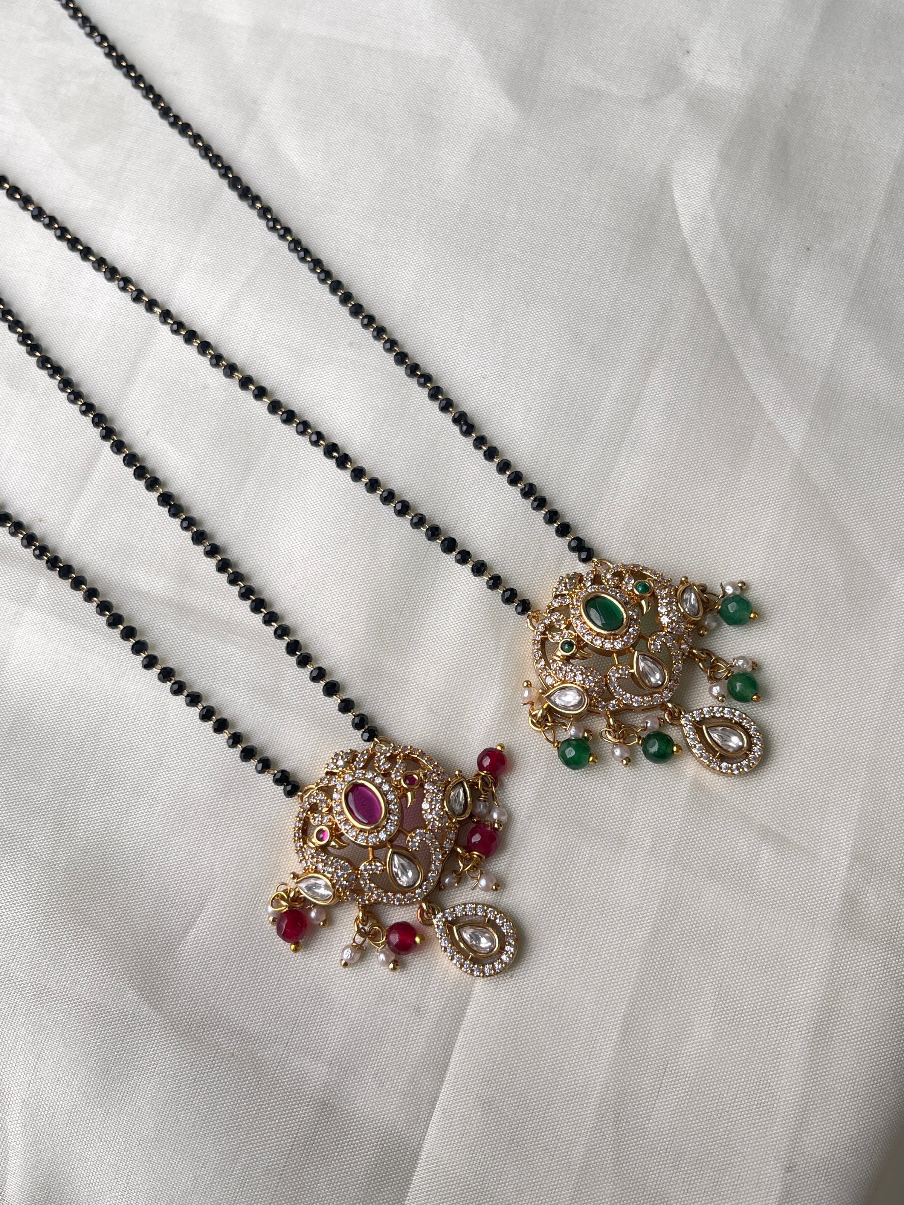 Dual peacock moissanite single line blackbeads