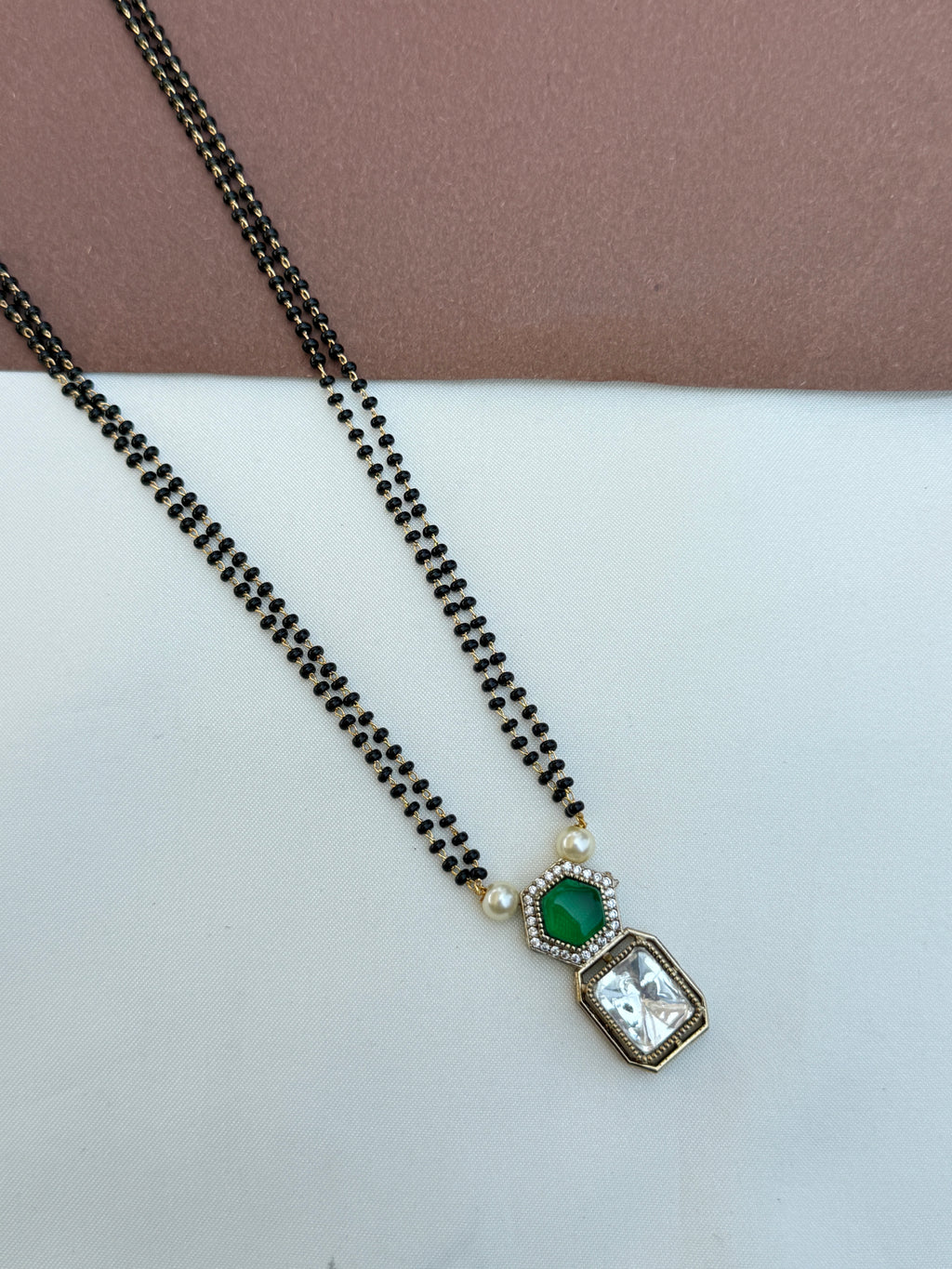 Bb064 2 lines 18 inches blackbeads with green and white stone pendent