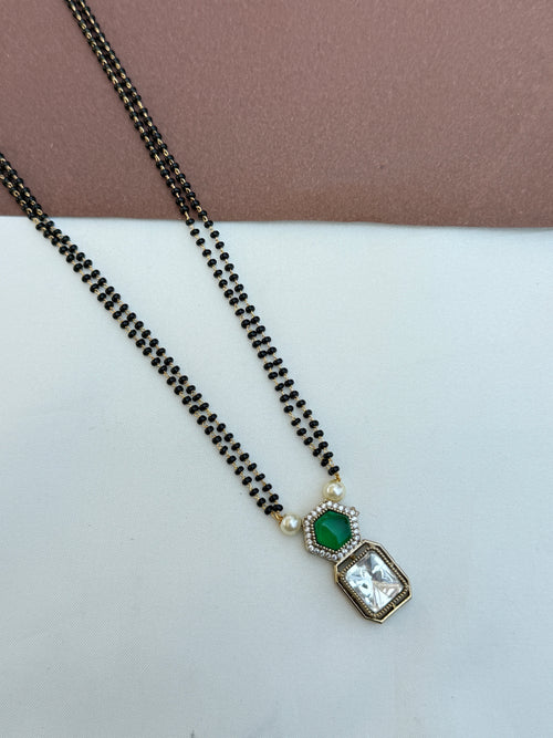 Bb064 2 lines 18 inches blackbeads with green and white stone pendent