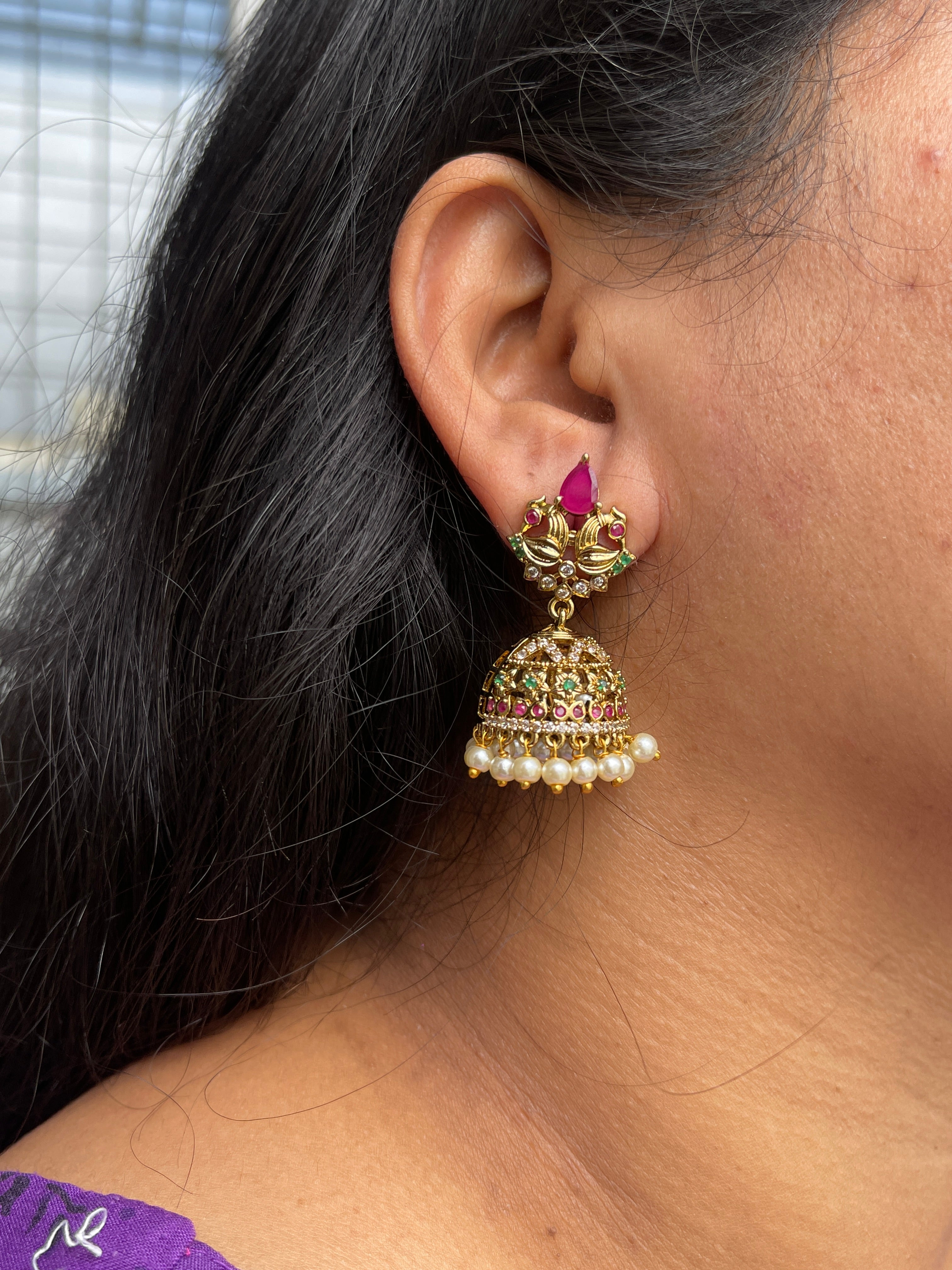 Dual peacock butta earrings