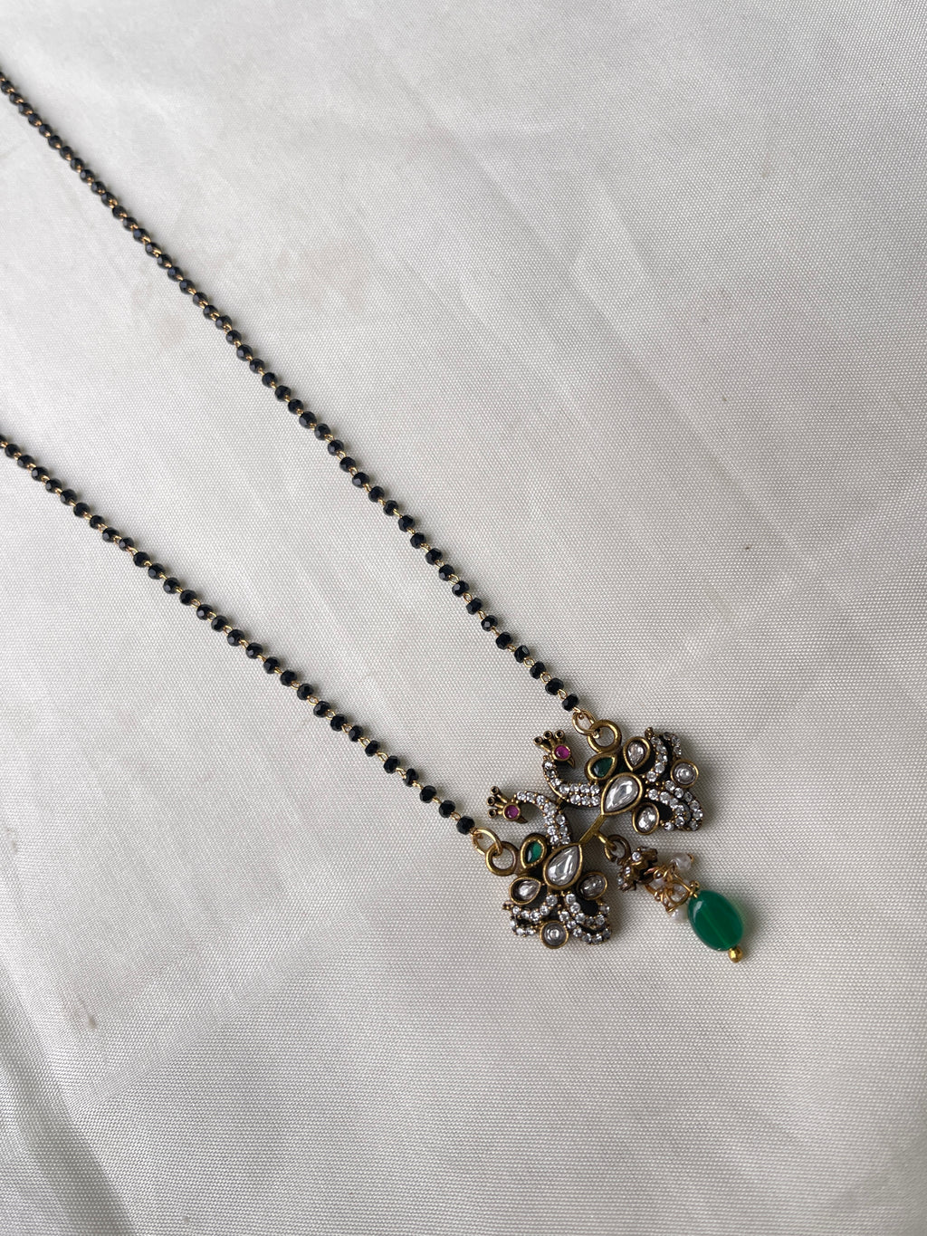 Dual peacock Victorian single line short blackbeads