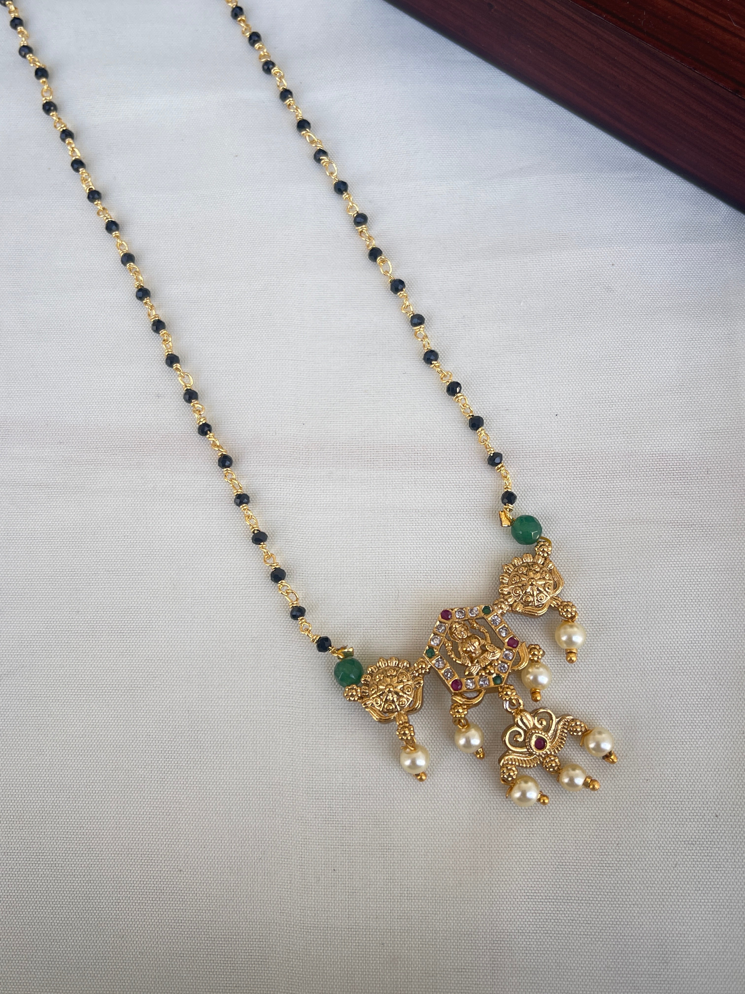 Single line short blackbeads with Lakshmi Devi pendant