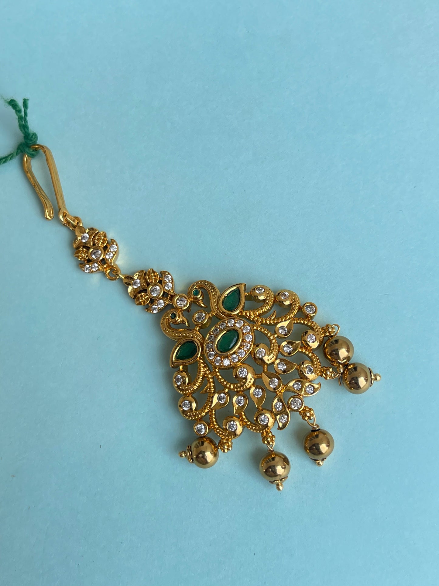 Green antique tikka with gold balls