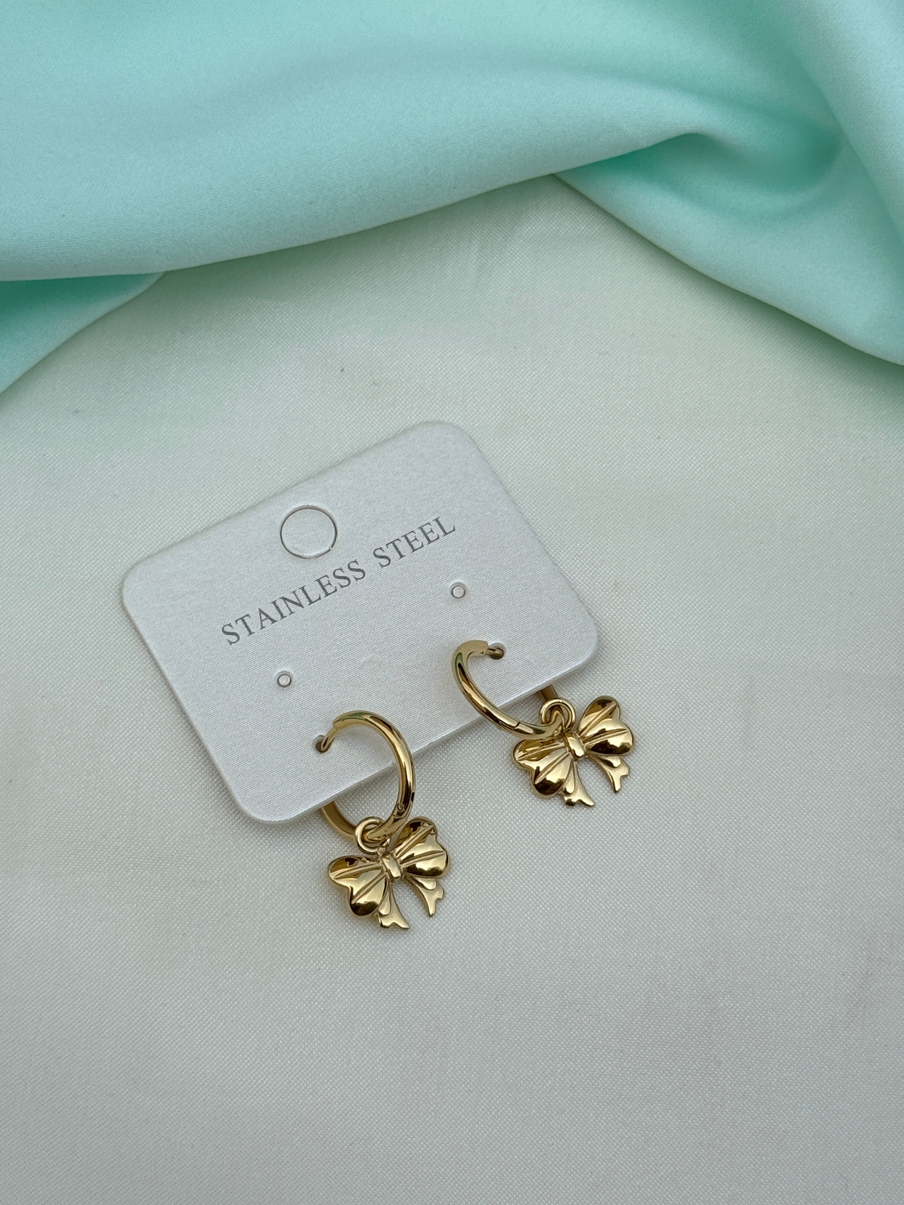 Er270 anti tarnish locksystem bow earrings