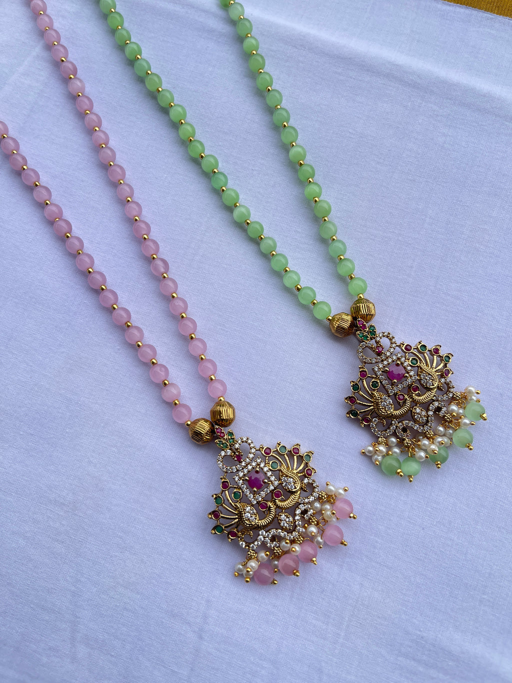 Multi peacock pendant single line beads chain in light green and light pink