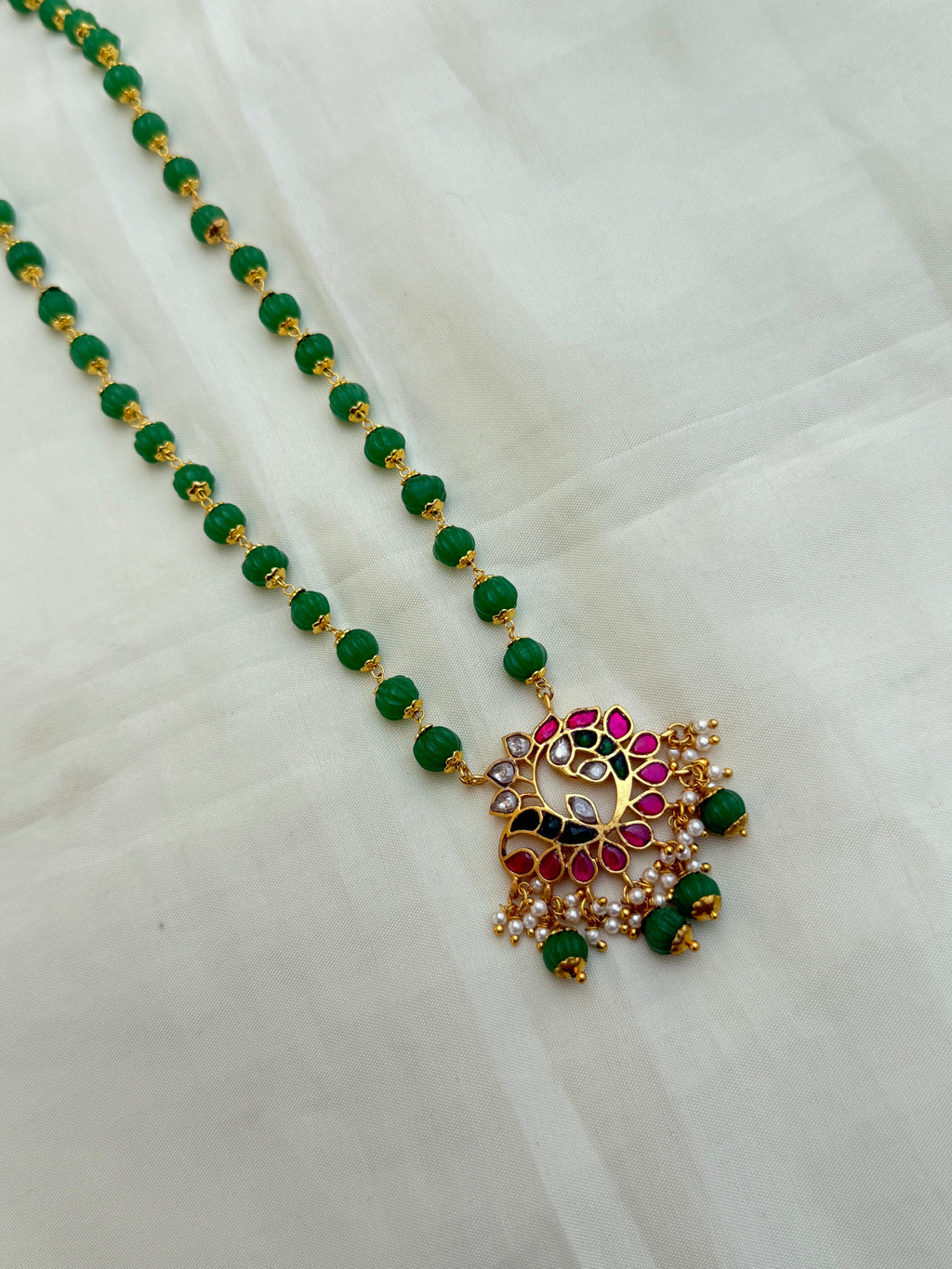 Jk009 pumpkin beads with jadau Kundan pendant
Size(20-22) inches approximately