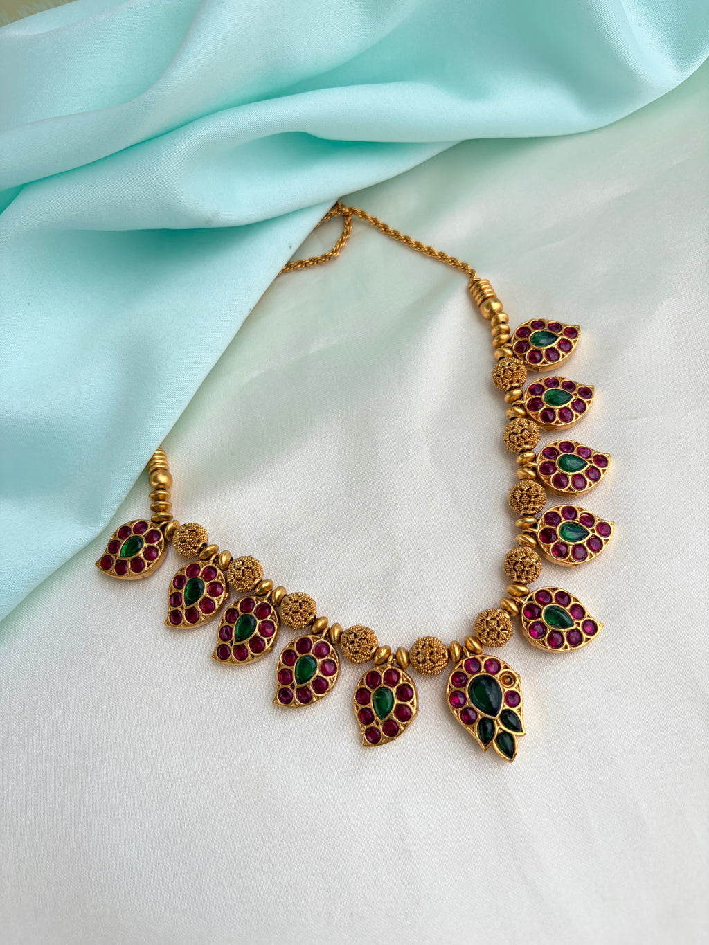 2-in-1 Dual-Sided antique gold Mango motif neckset with Ruby, Emerald, and kundan Stones Ns946