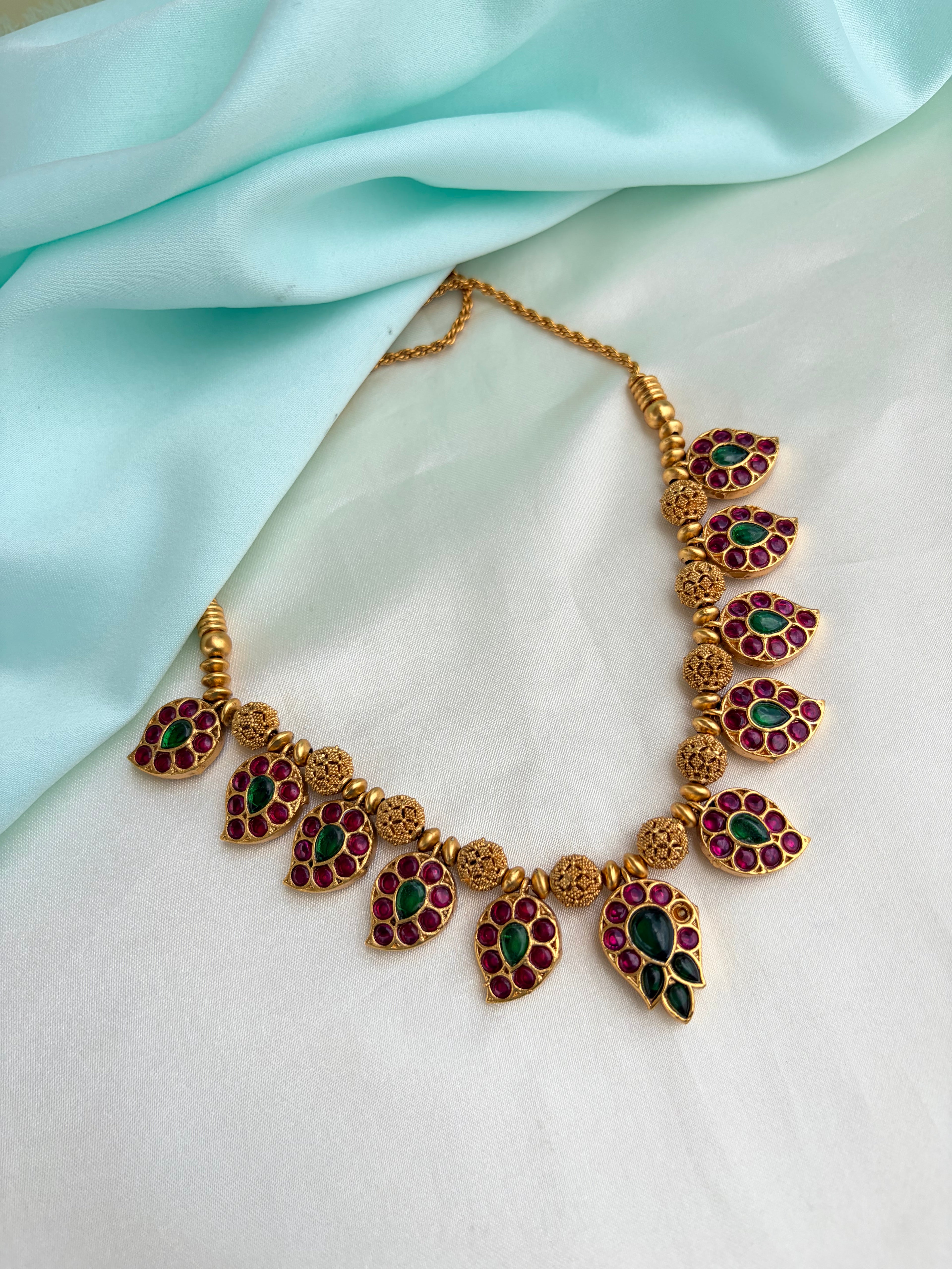 2-in-1 Dual-Sided antique gold Mango motif neckset with Ruby, Emerald, and kundan Stones Ns946
