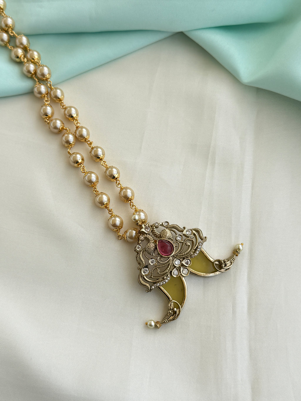 Pg016 Puligoru pendant with 24 inches pearl chain