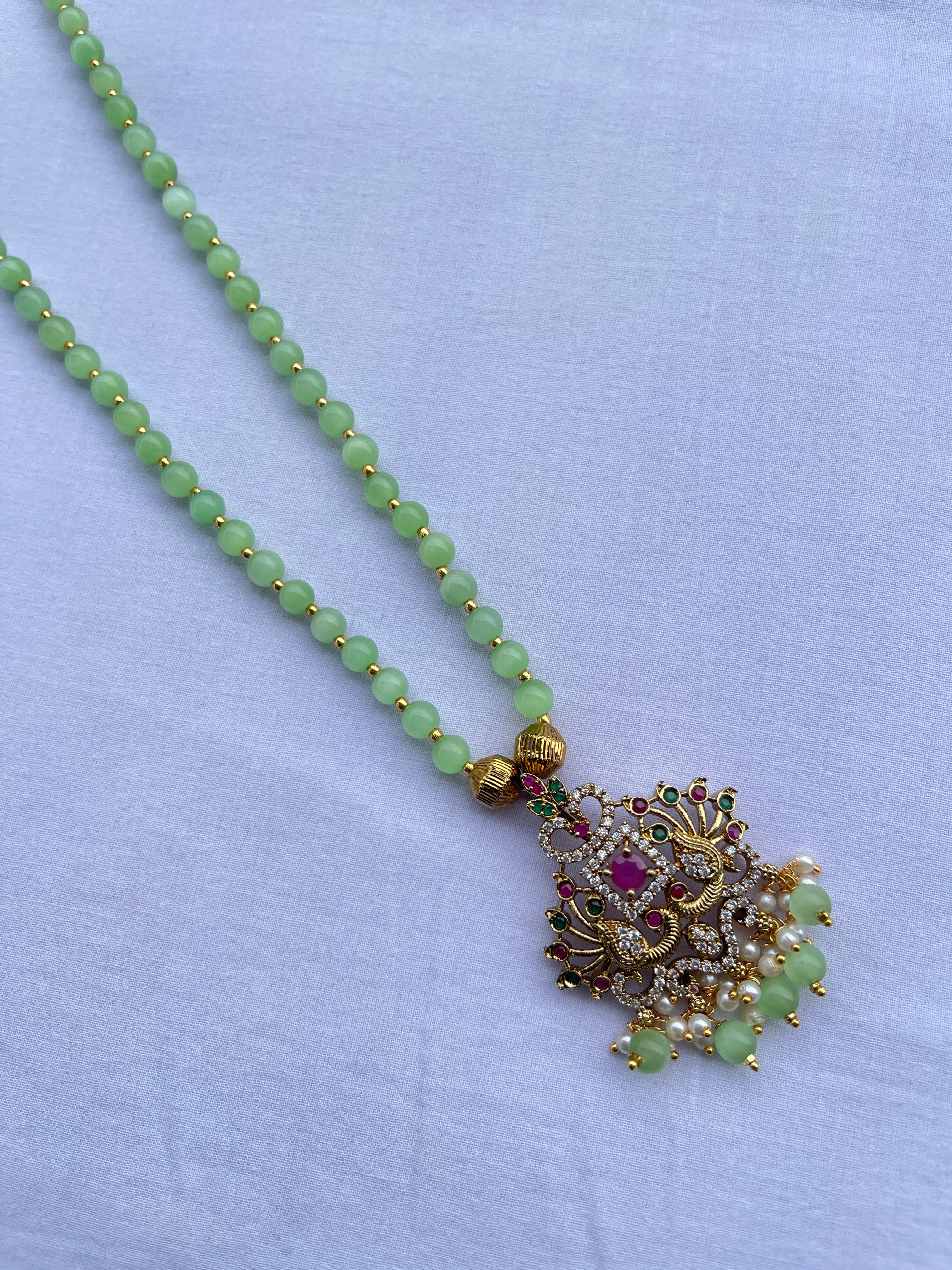 Multi peacock pendant single line beads chain in light green and light pink